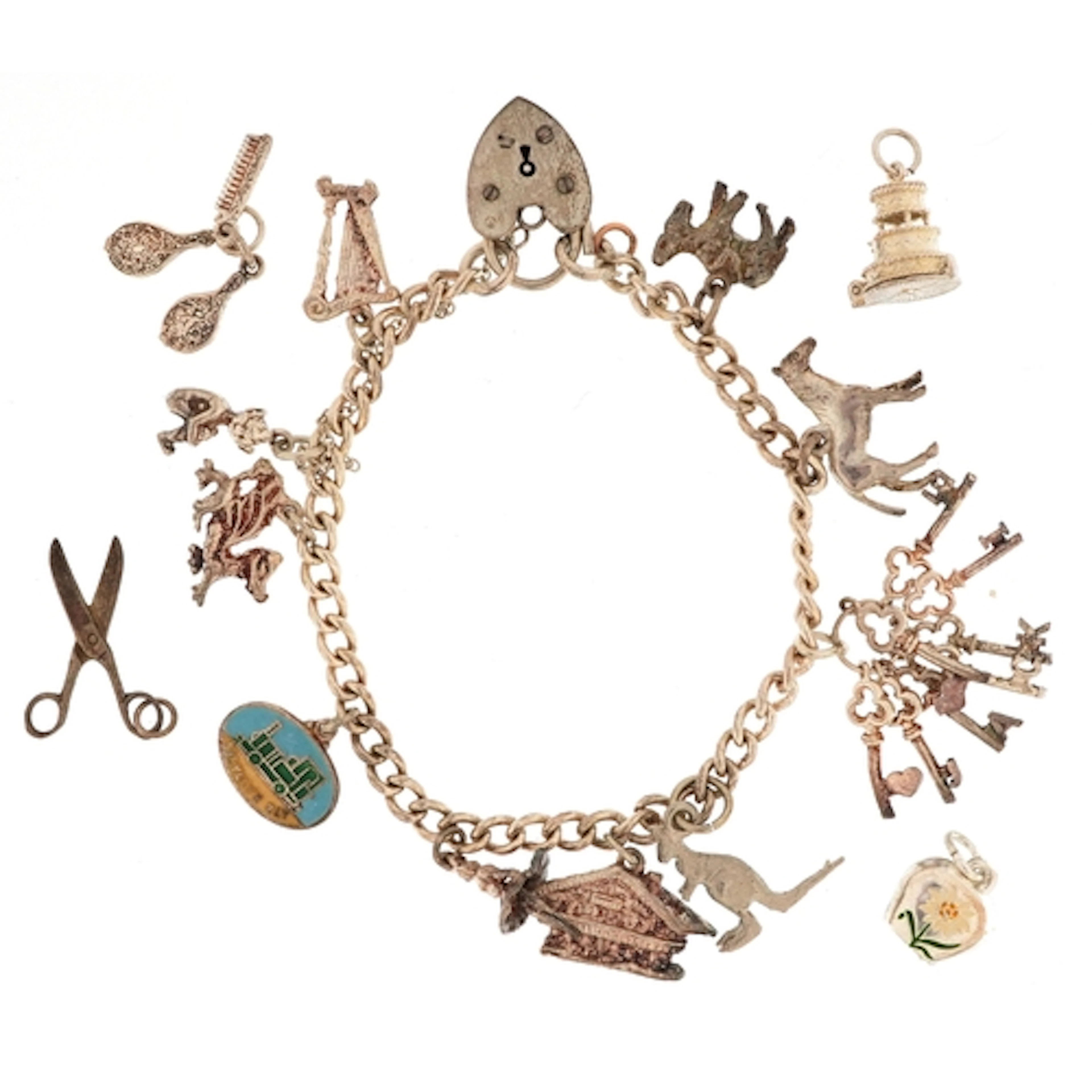 Silver charm bracelet with a large selection of mostly silve...