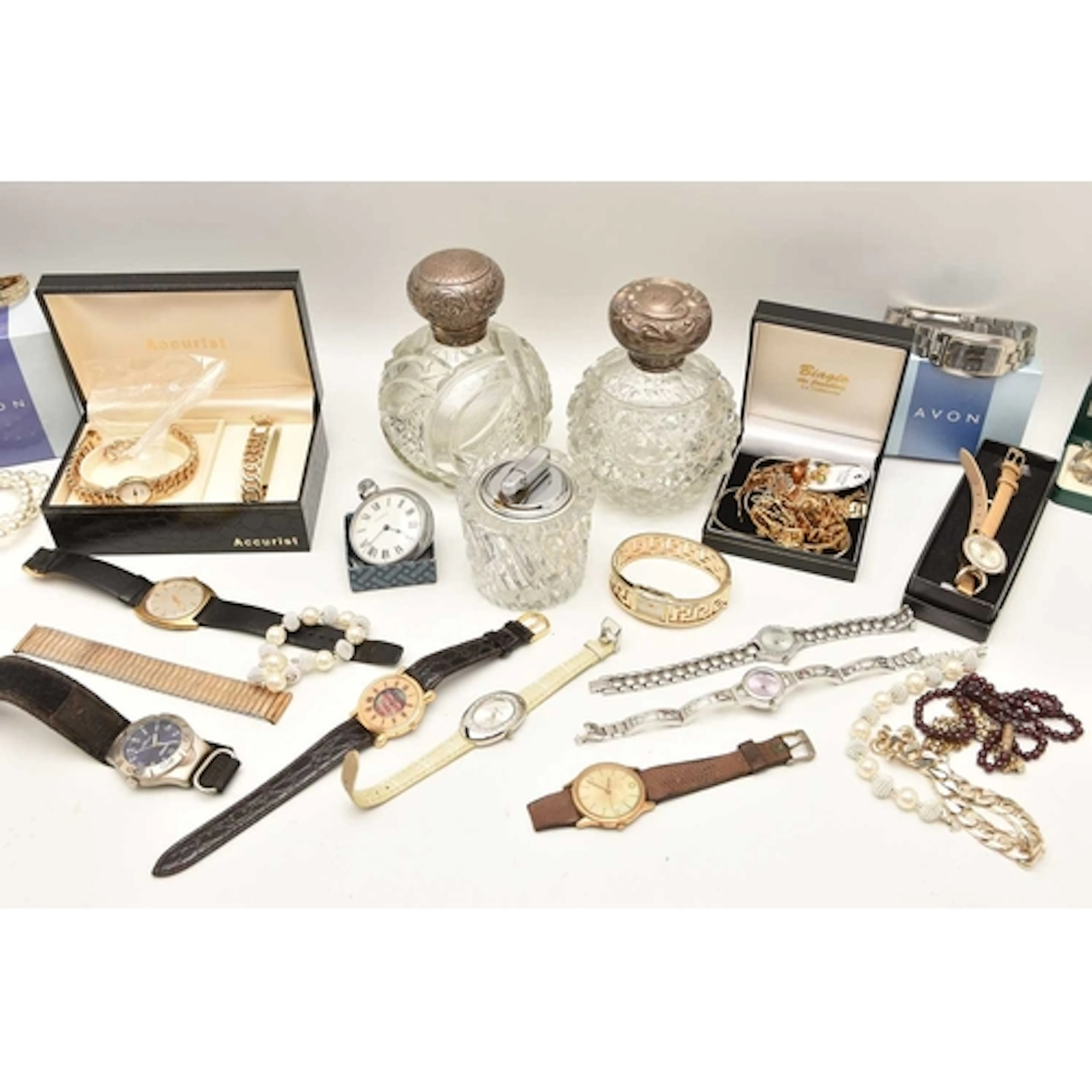 A collection of costume jewellery, watches, lighters and sil...