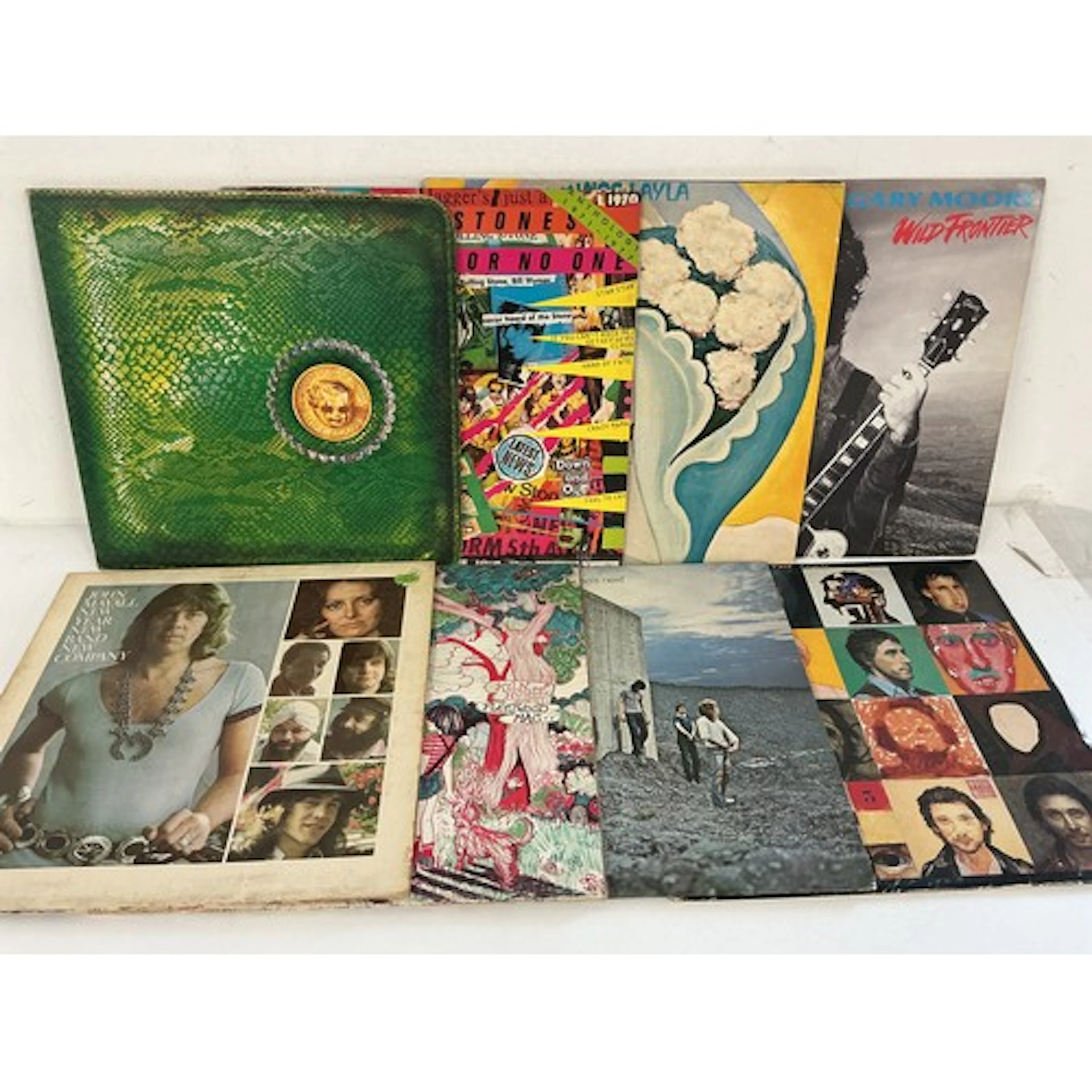 Two bags containing 16 rock LPs by various artists including...