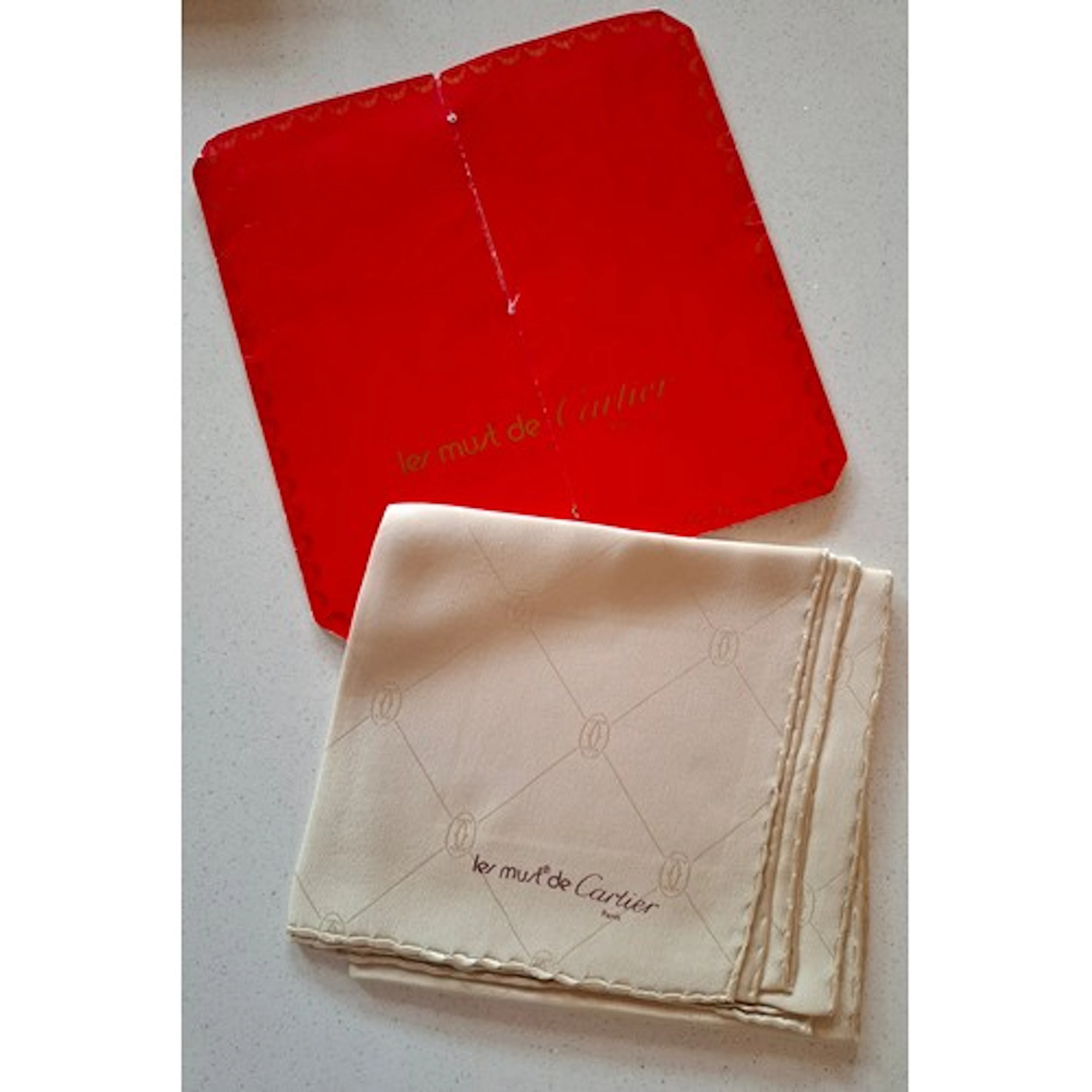 Cartier- A vintage Must de Cartier cream silk scarf with han...