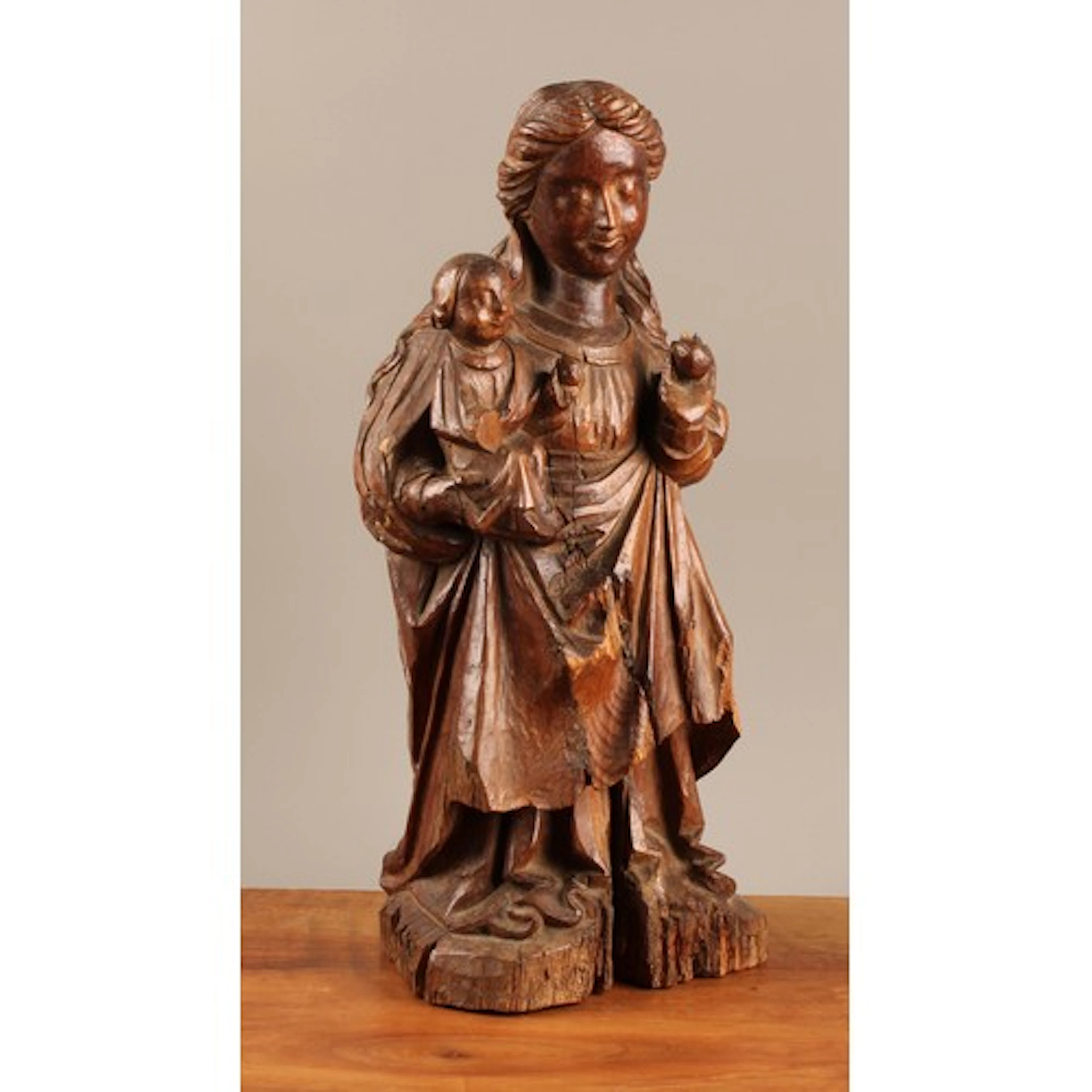 A Continental softwood carving, Madonna and child, 44cm high