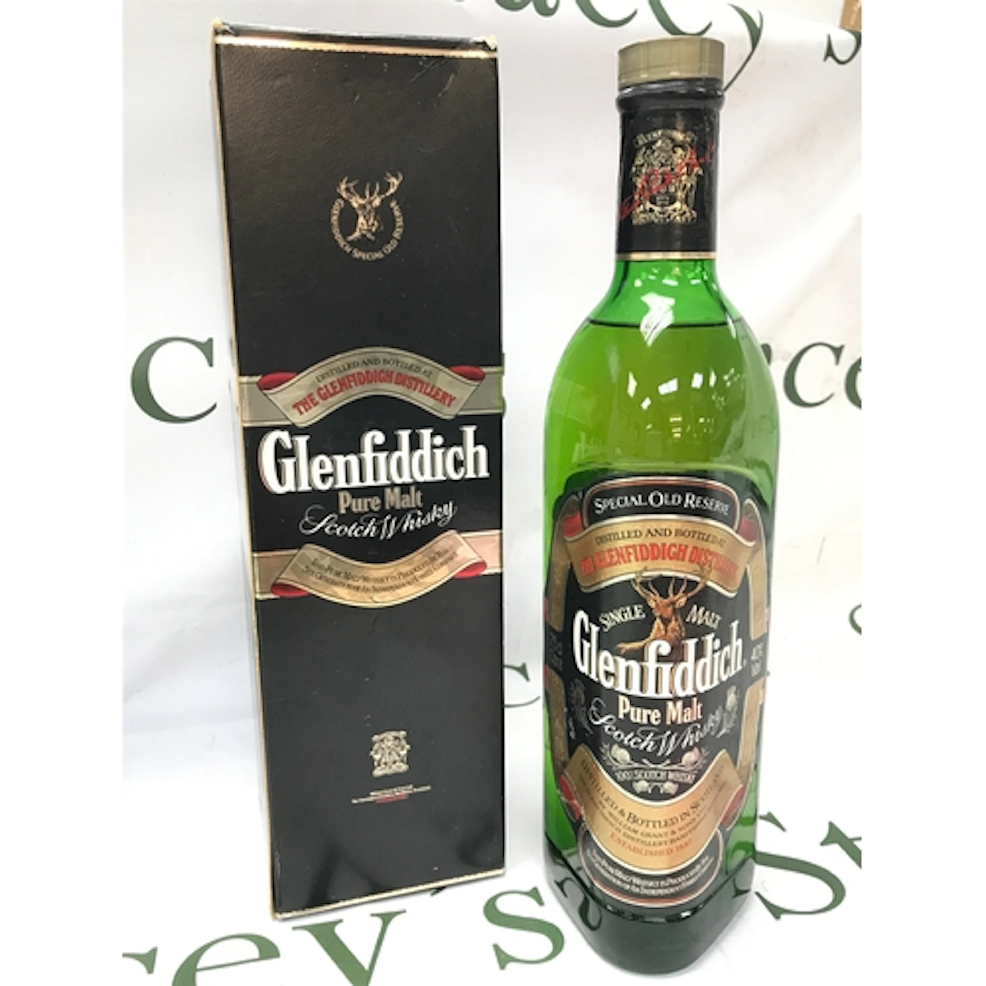 A boxed bottle of old Glenfiddich pure malt