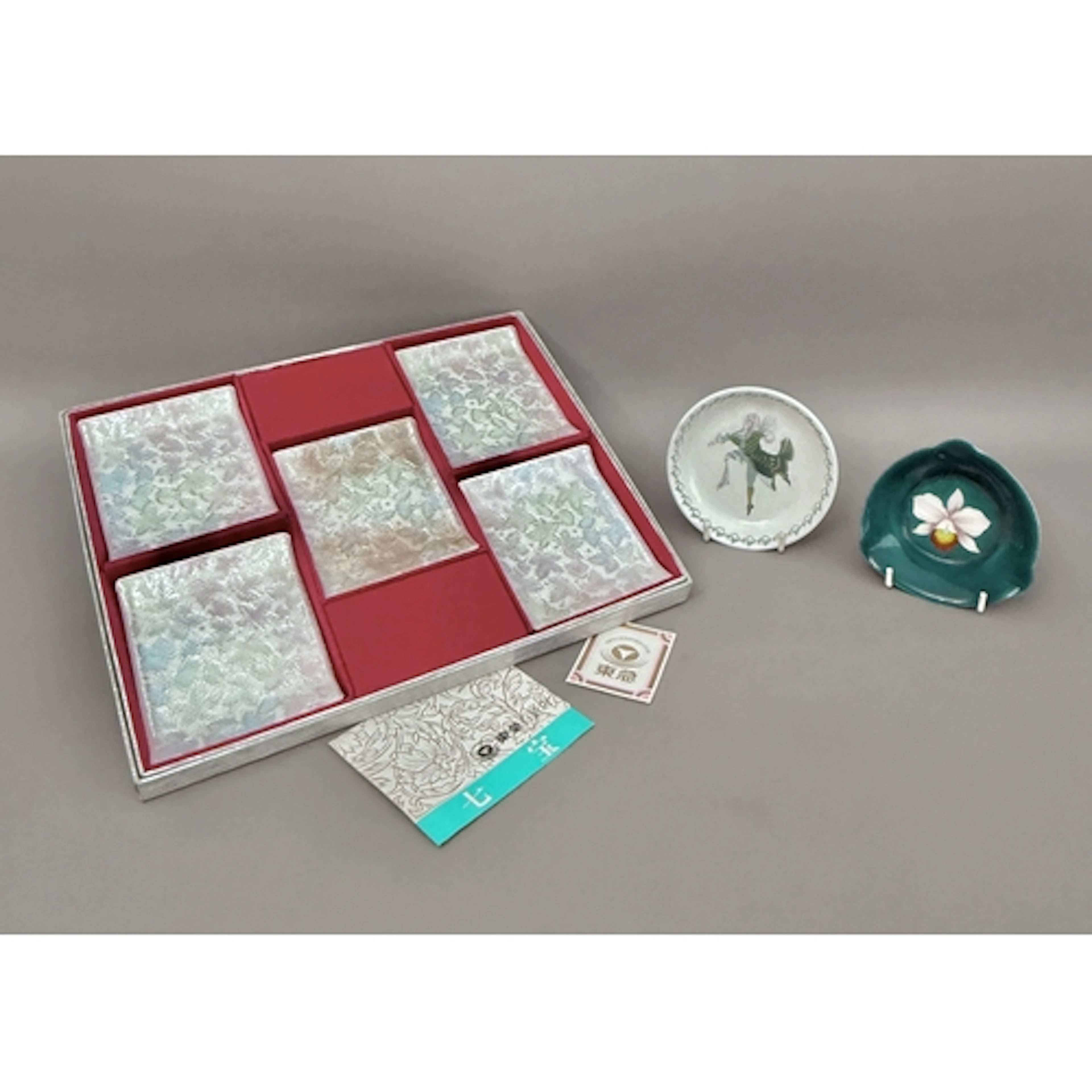 A boxed set of Japanese cloisonné shallow dishes - five in t...