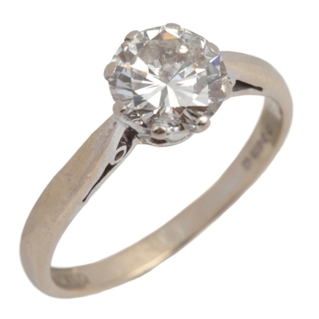 A diamond solitaire ring, circa 1980, claw-set with a brilli...