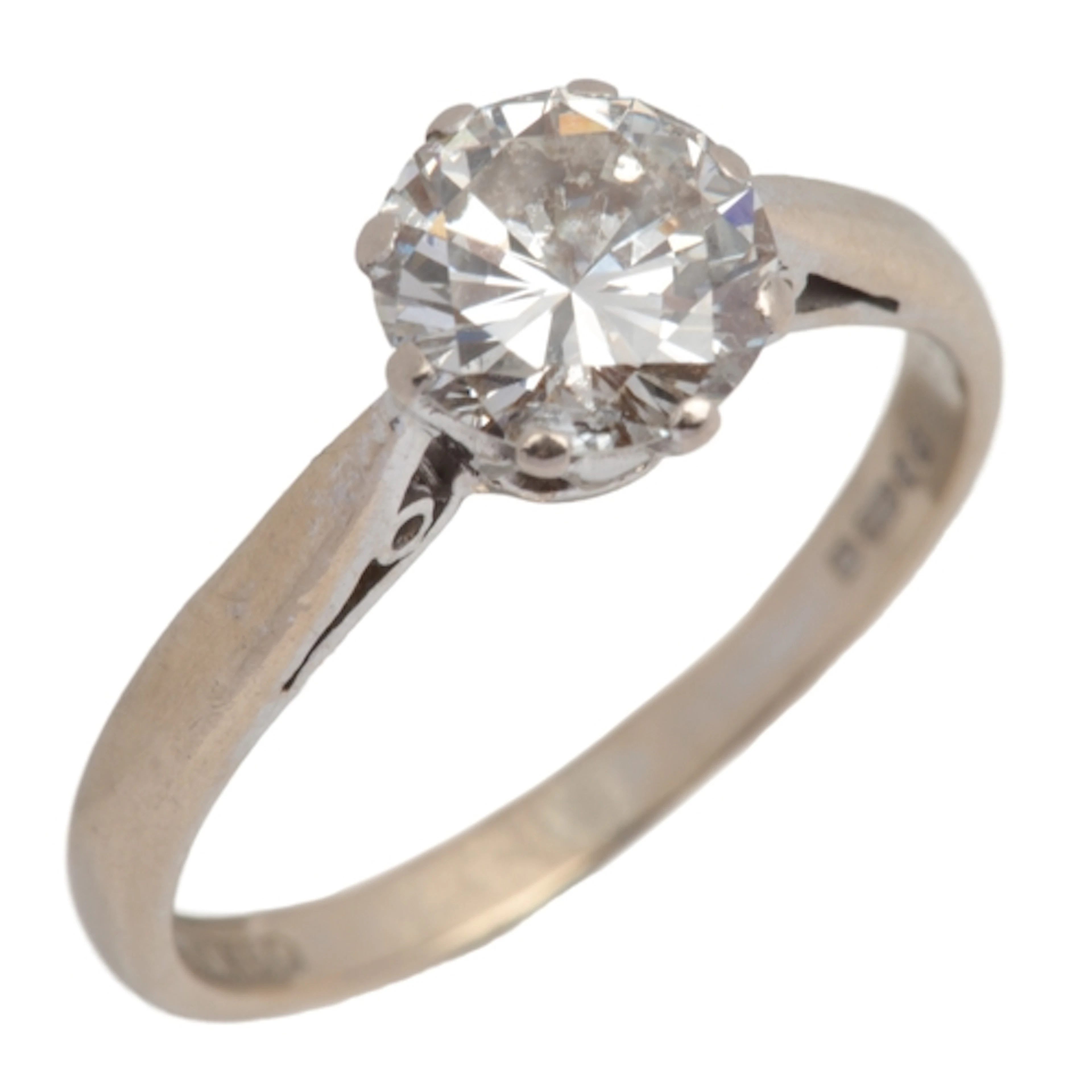 A diamond solitaire ring, circa 1980, claw-set with a brilli...