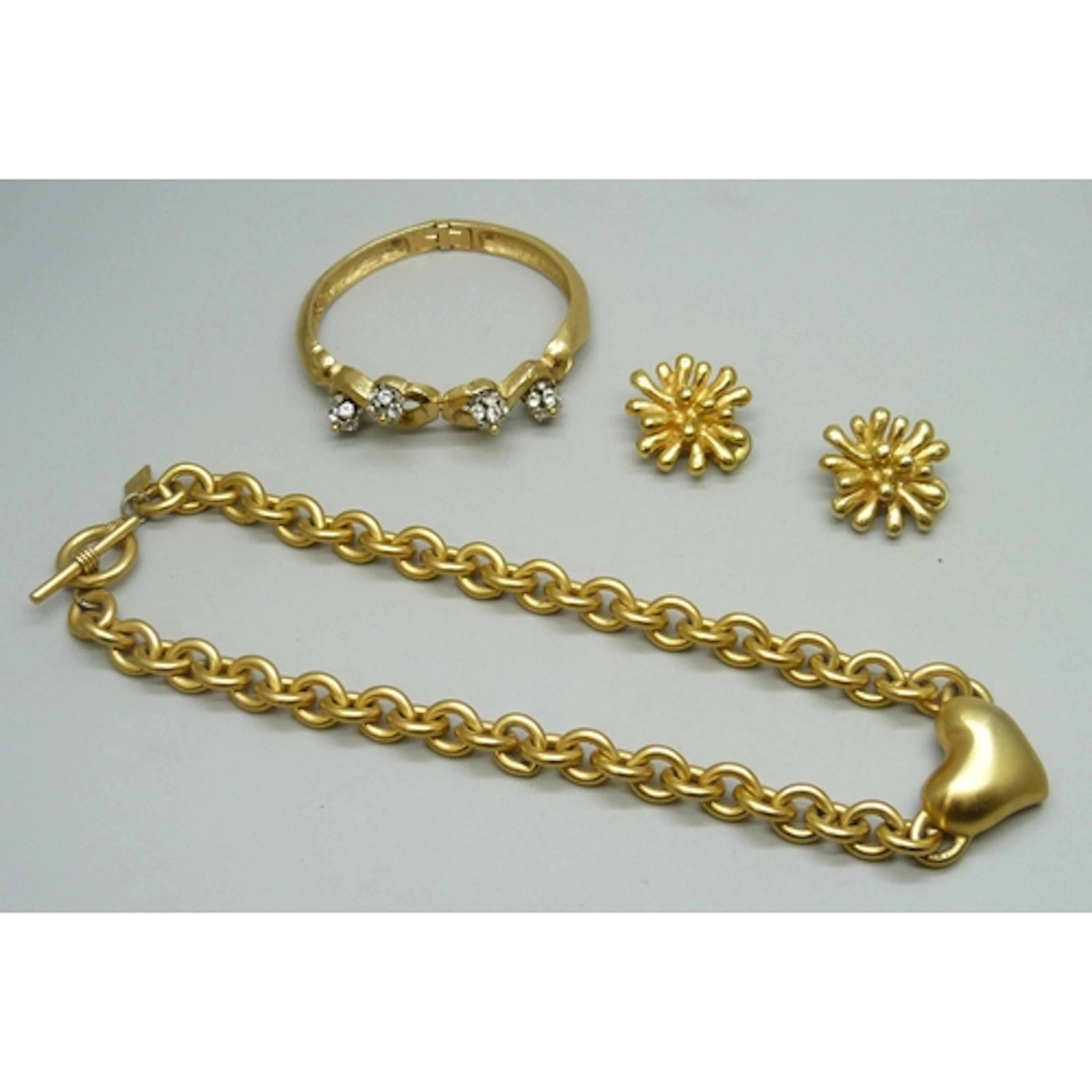 A Christian Lacroix bangle (some stones missing) and a pair ...