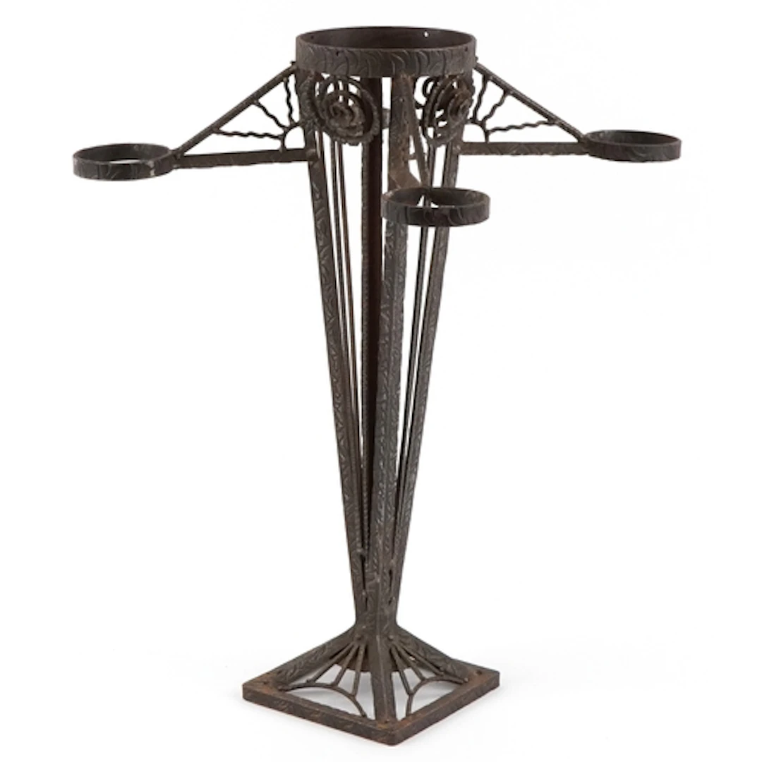 Arts & Crafts wrought iron smokers stand, 64cm high.