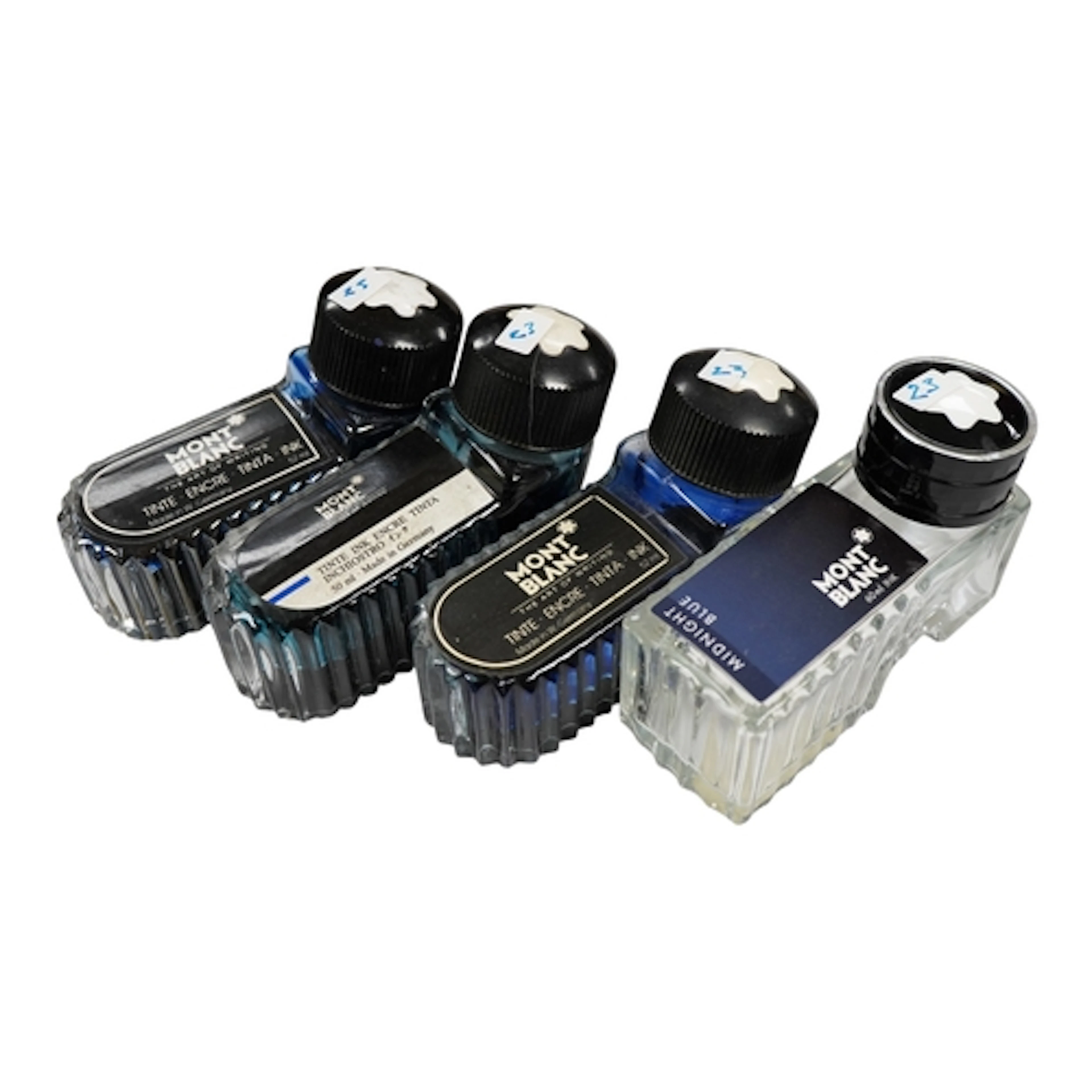 Four Montblanc ink bottles, one with silver rim
