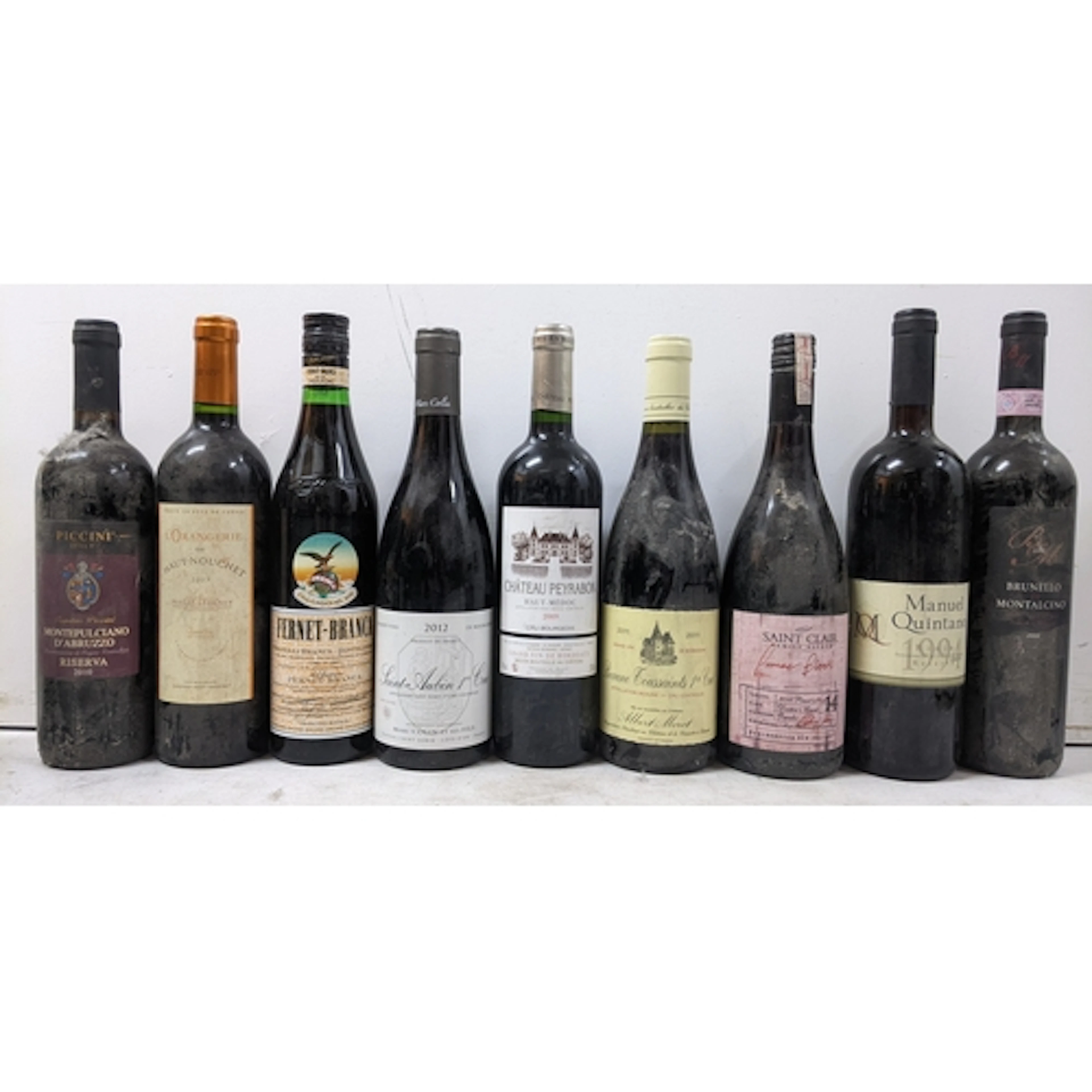 A mixed group of nine bottles of wine and fortified wine, co...