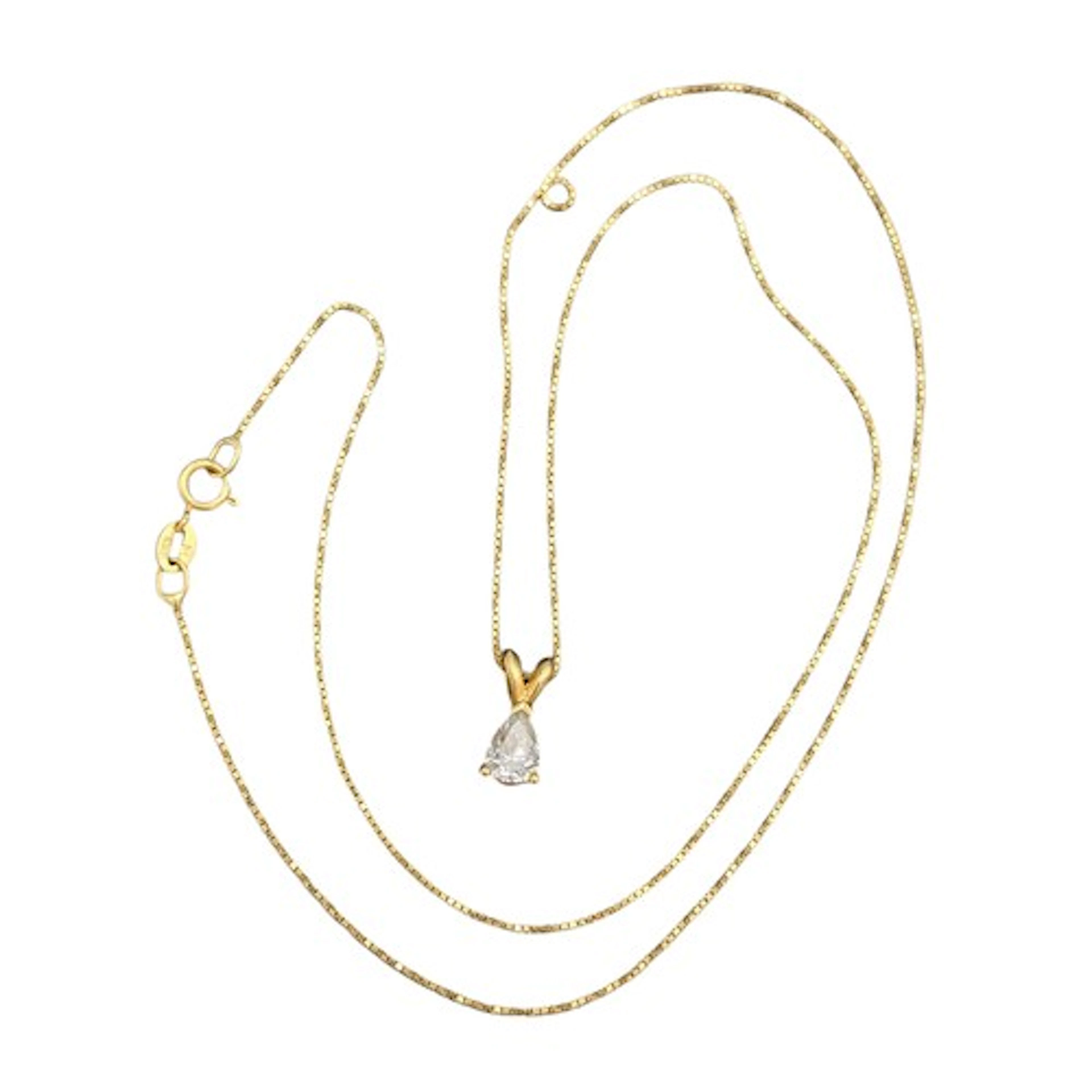 An 18ct gold diamond pendant necklace, with single pear cut ...