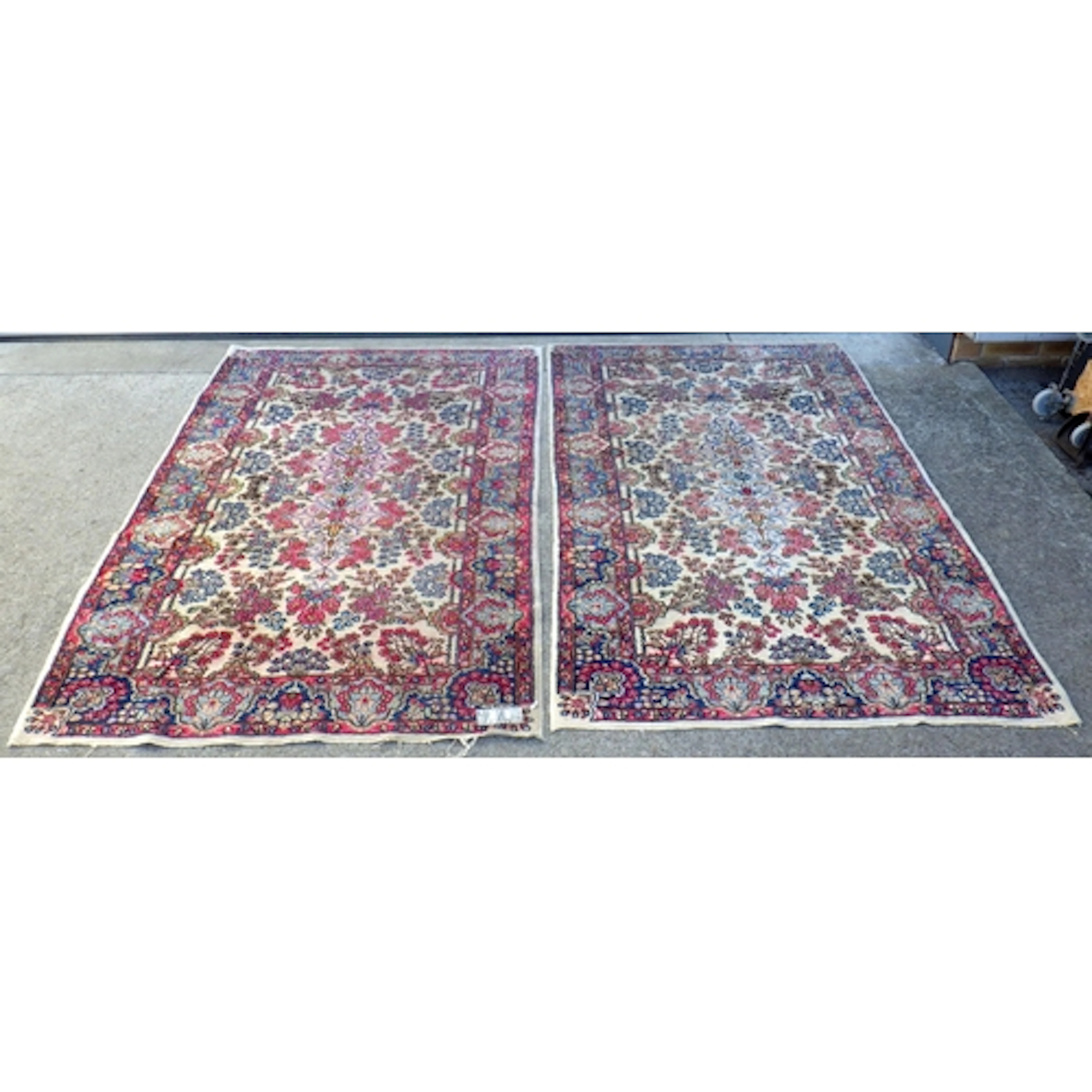 Two floral style rugs