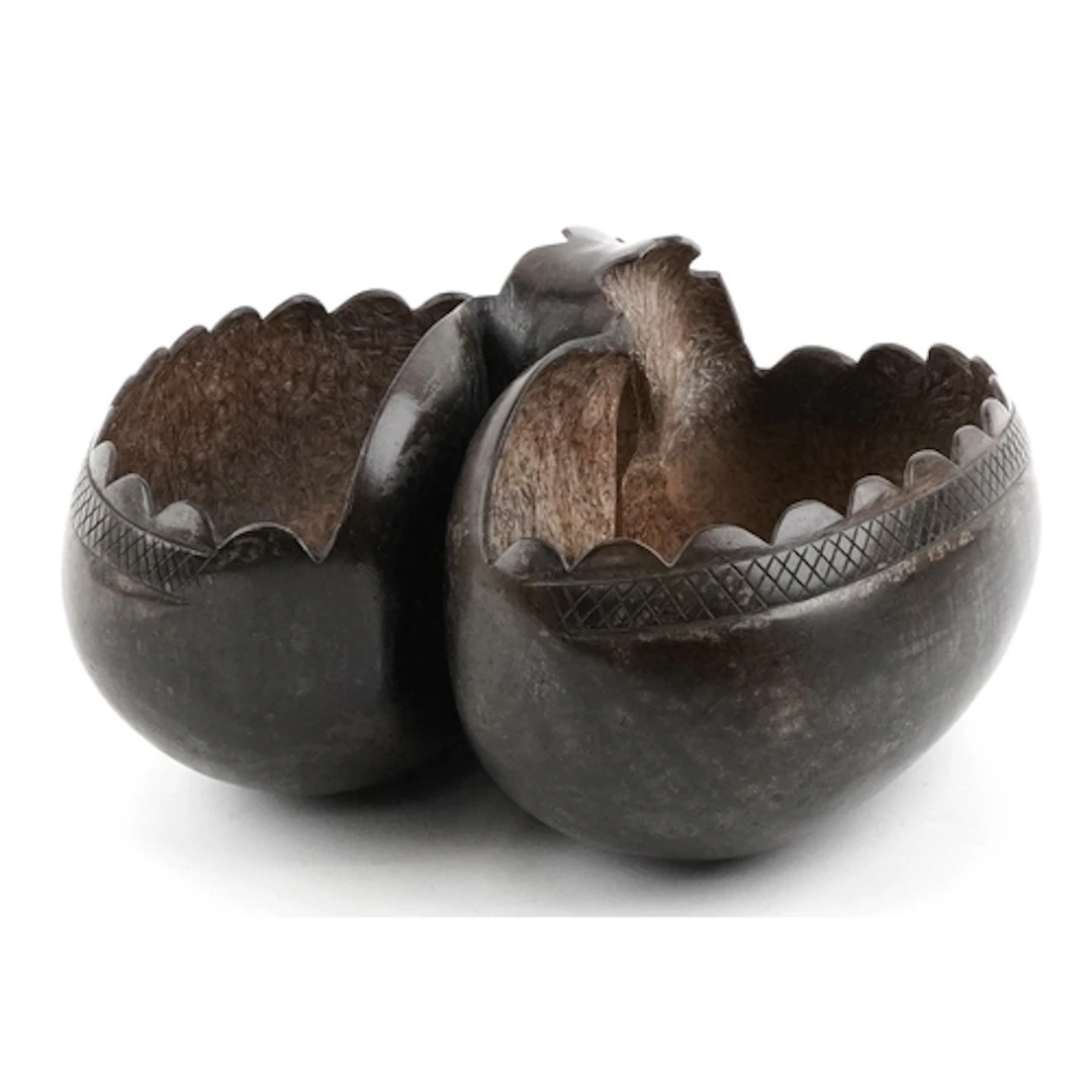 Tribal interest carved coco de mer nut with hand carved cros...