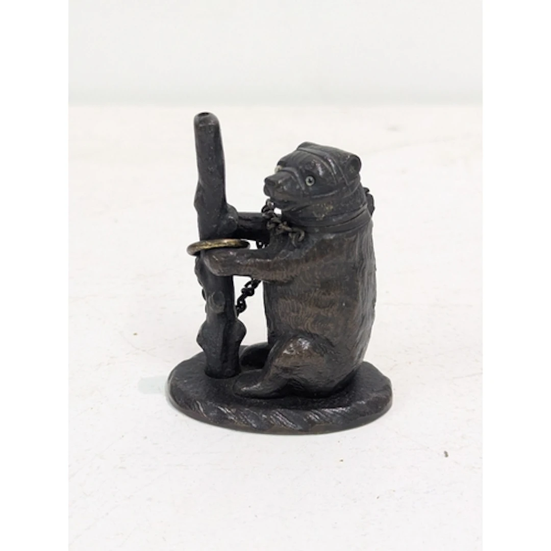 A 19th century bronze match stick holder, fashioned as a bea...