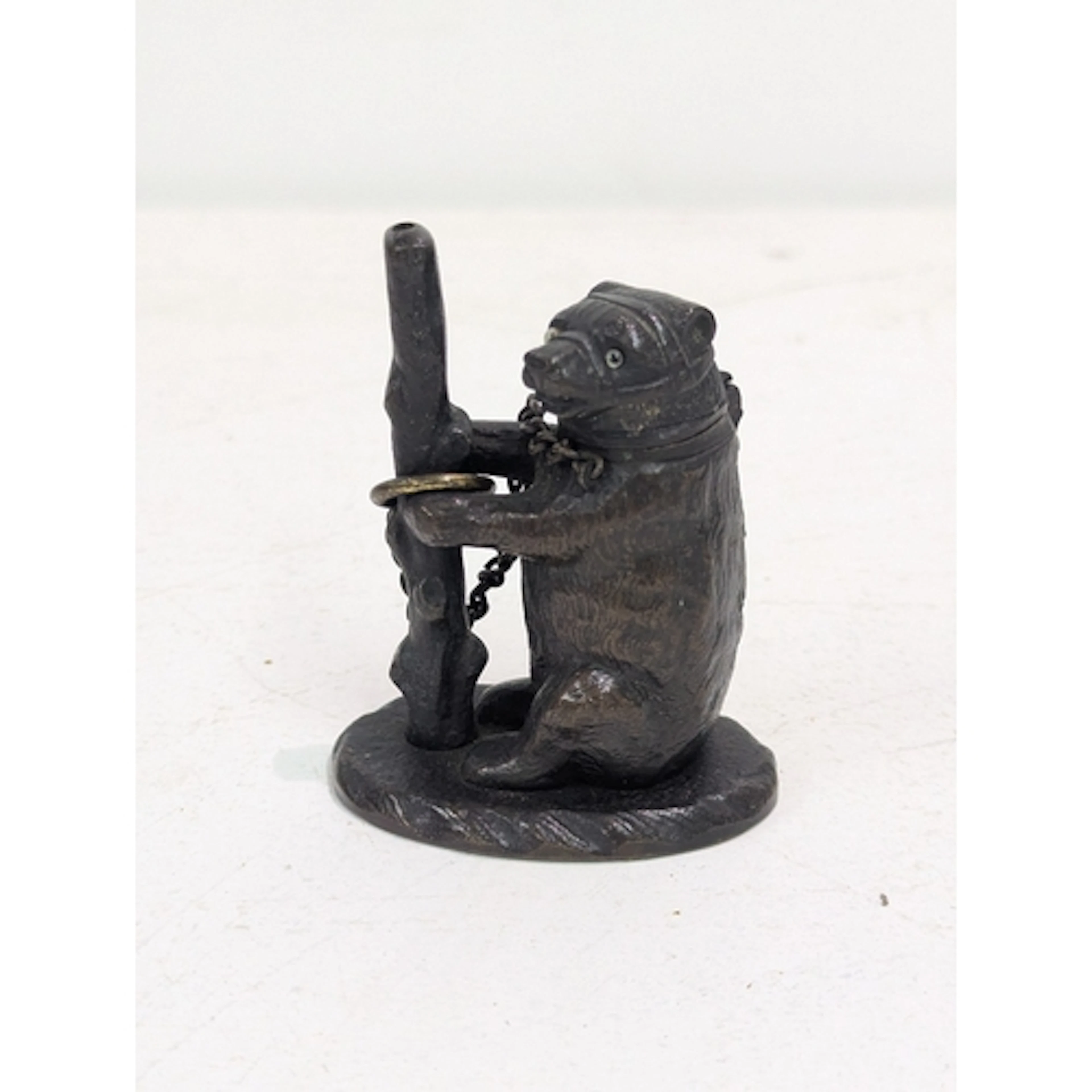 A 19th century bronze match stick holder, fashioned as a bea...