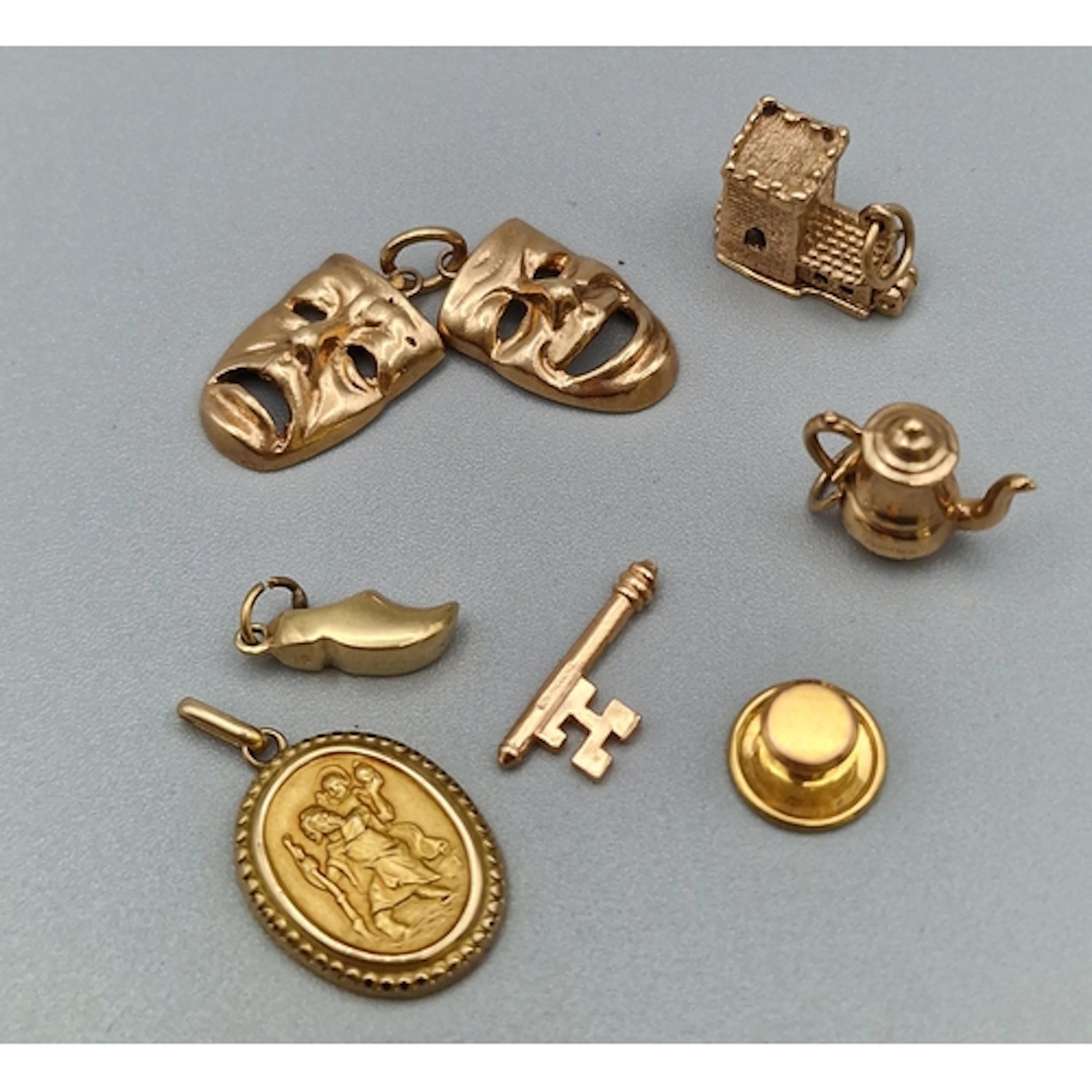 Collection of 9ct gold charms to include: key, Dutch clog, t...