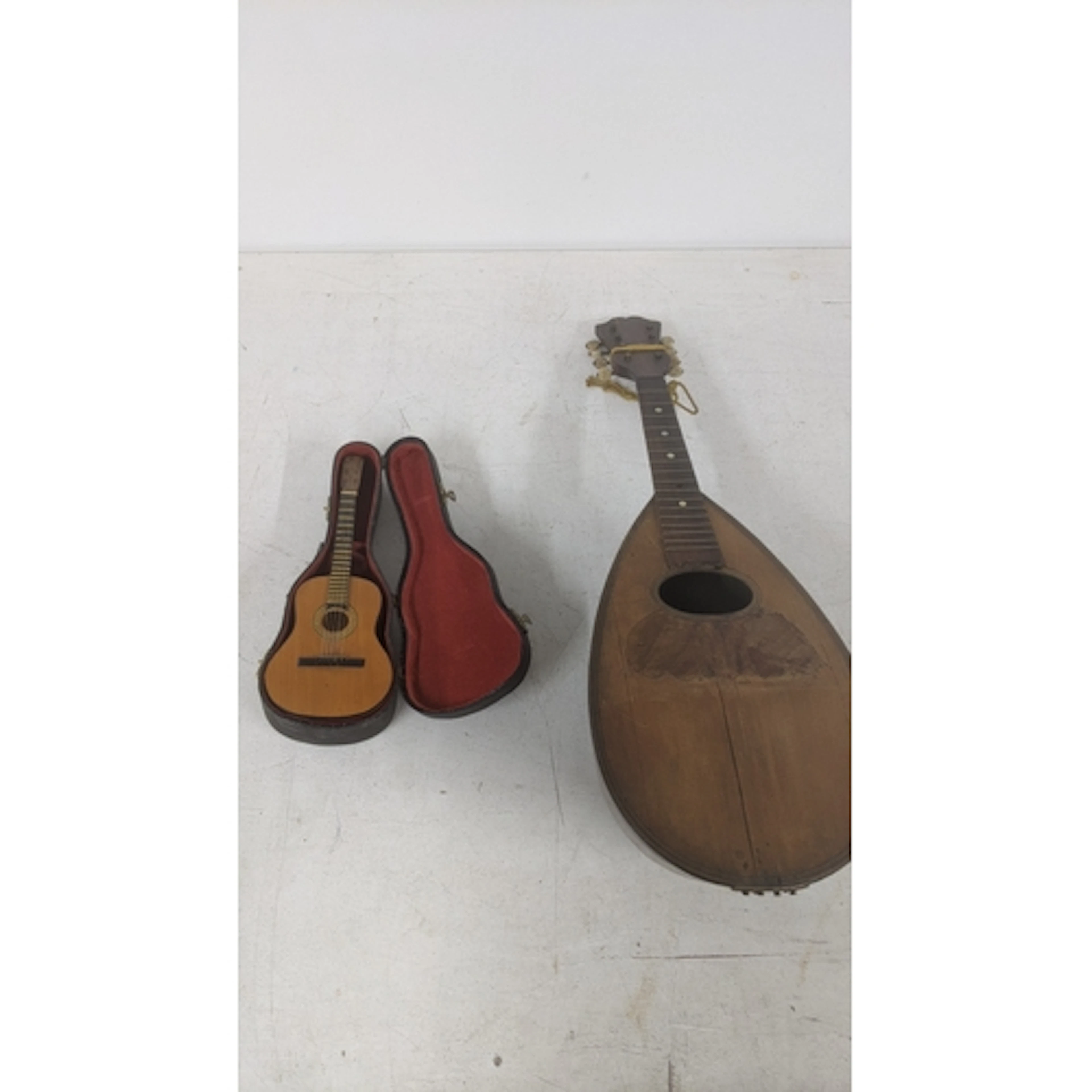 A Stridente of Napoli vintage mandolin A/F, along with a cas...
