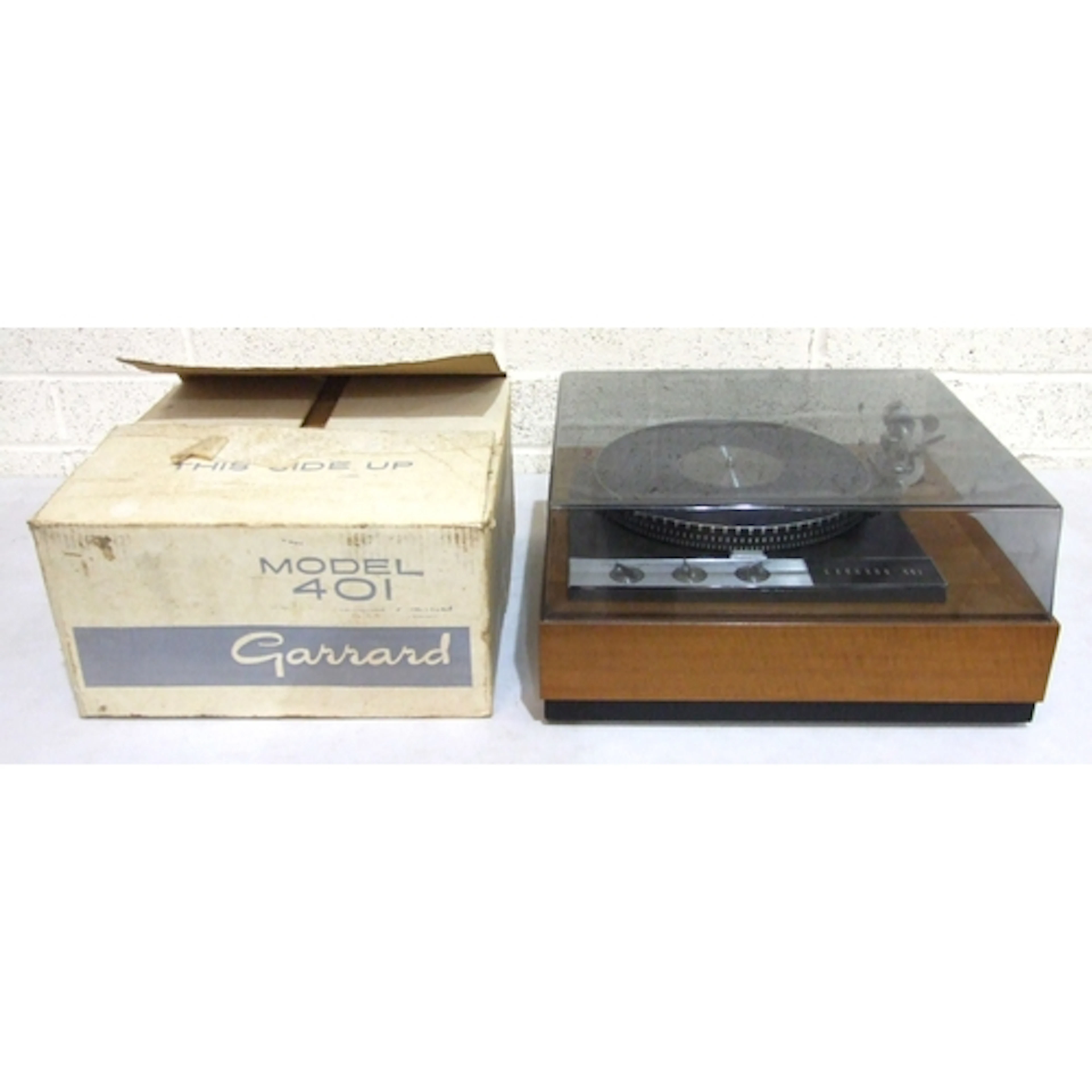 A Garrard Model 401 turntable with teak finish case, in orig...