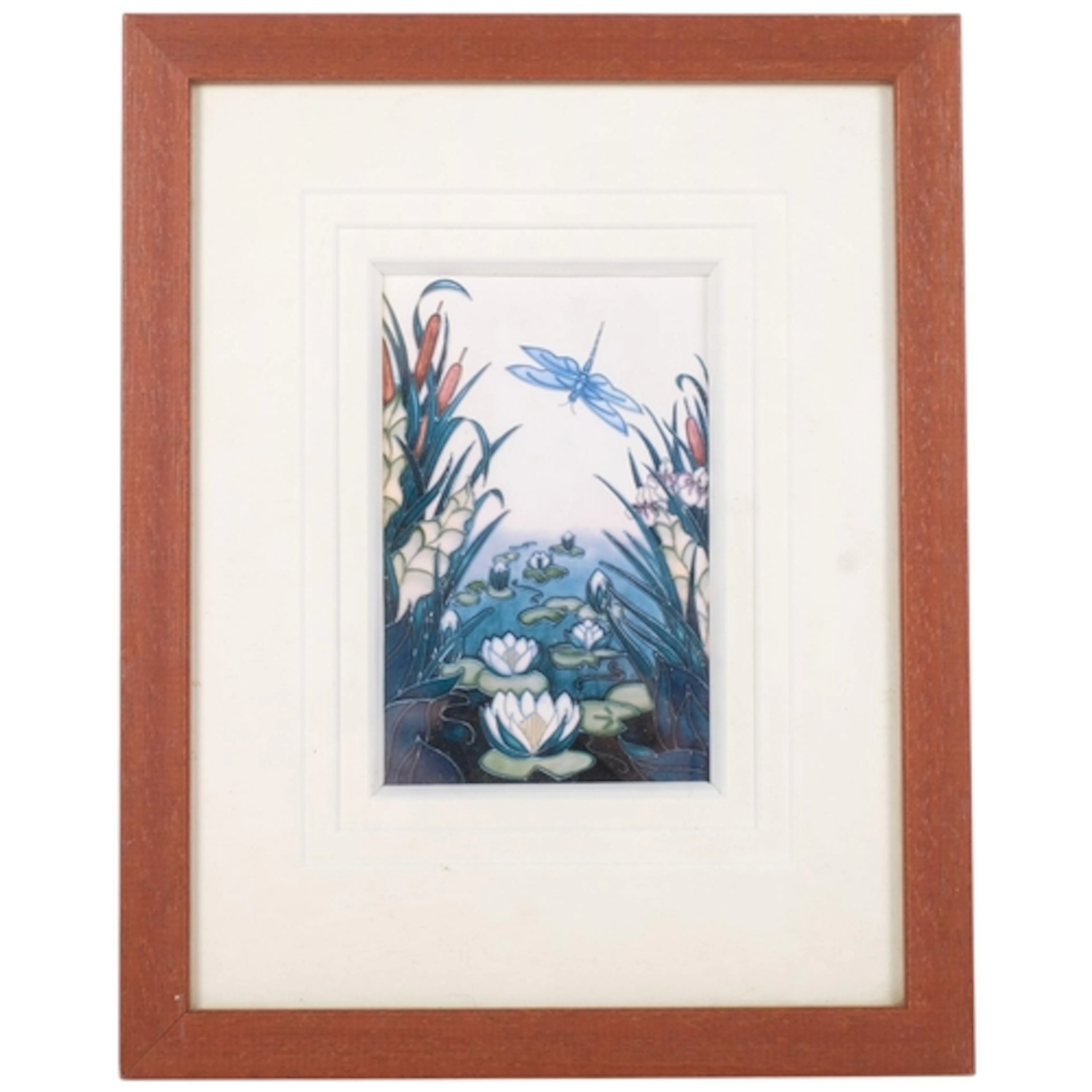 A framed Moorcroft painted tube-lined ceramic panel, depicti...