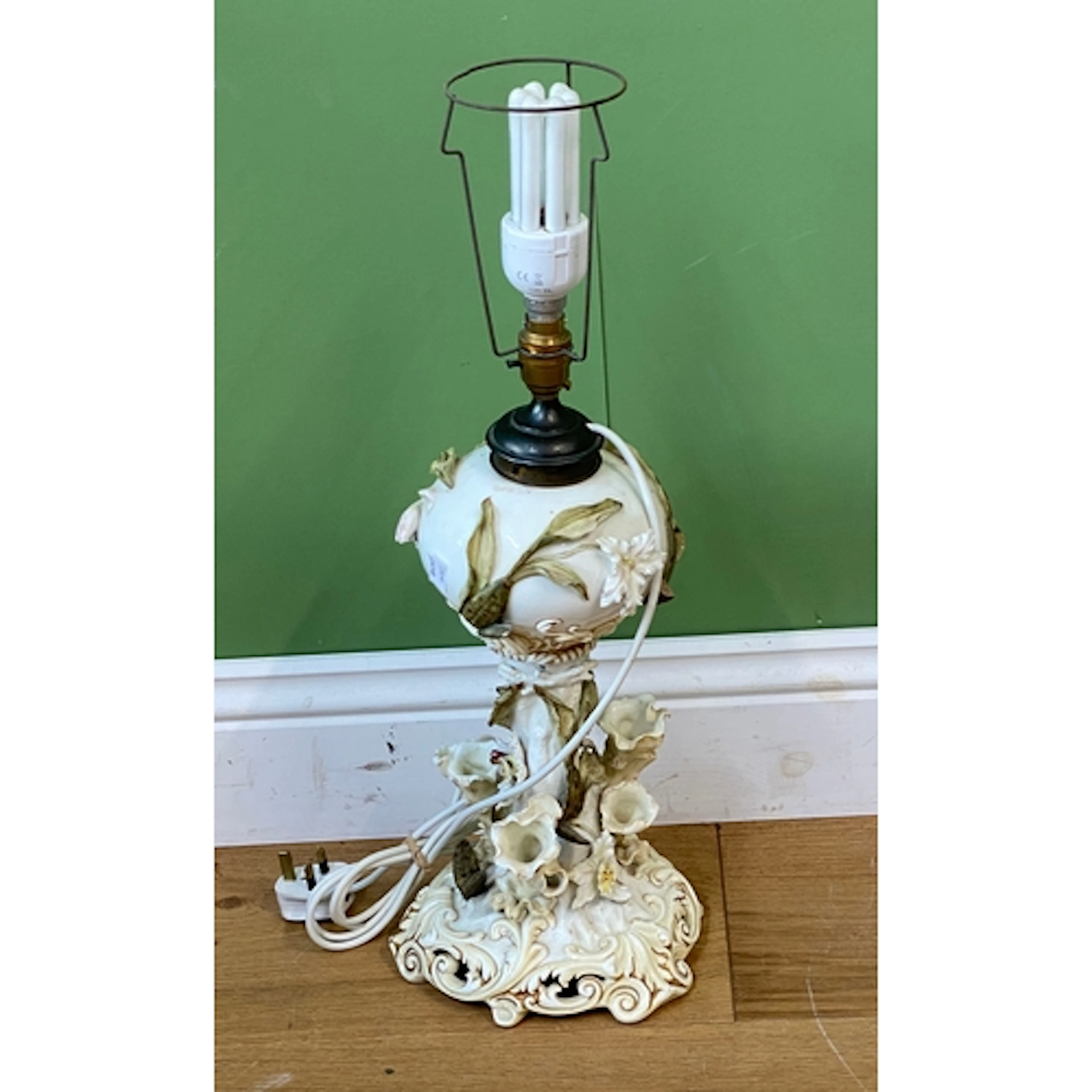 A Continental porcelain table lamp, modelled naturalistic wi...