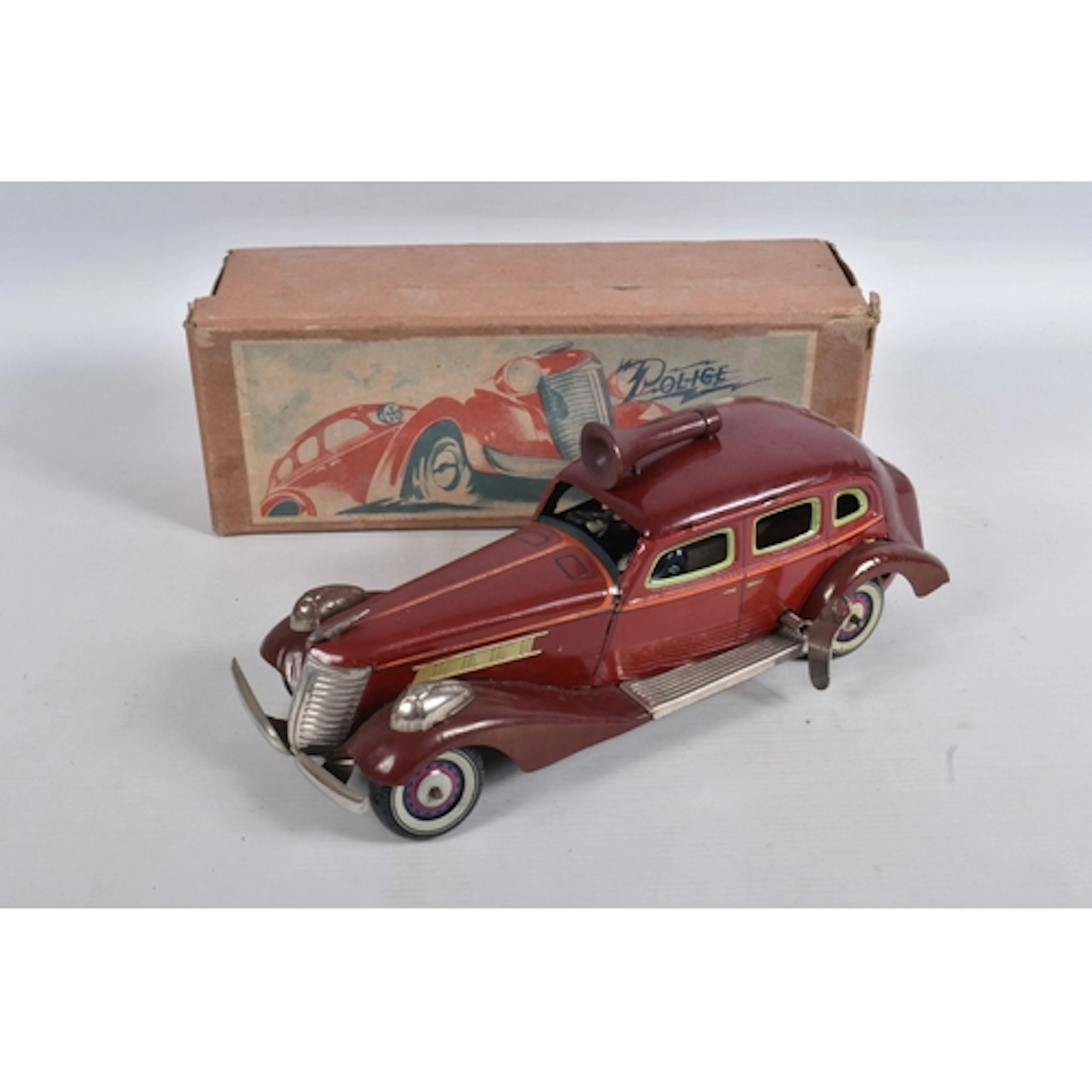 A KOSUGE (JAPAN) TINPLATE CLOCKWORK POLICE CAR WITH SIREN, c...