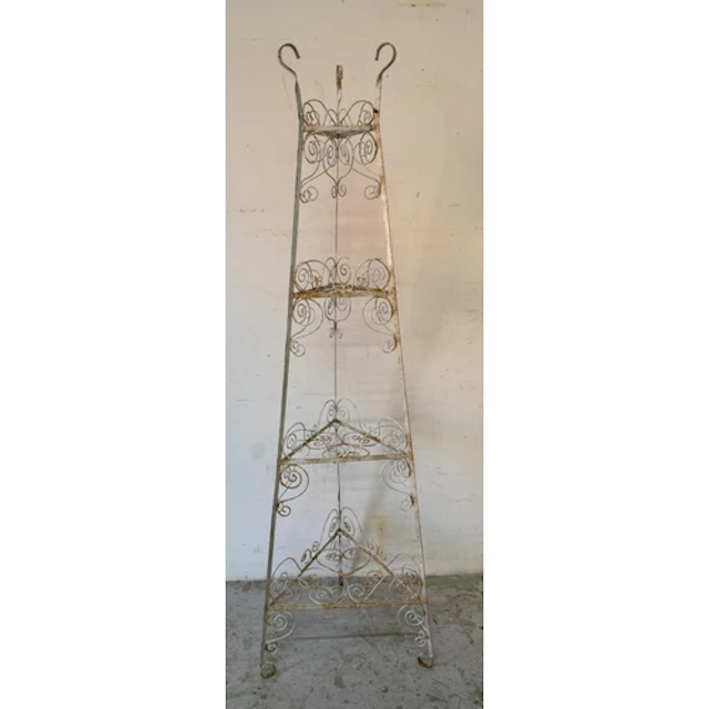 A white painted wrought-iron three tier corner plant stand...