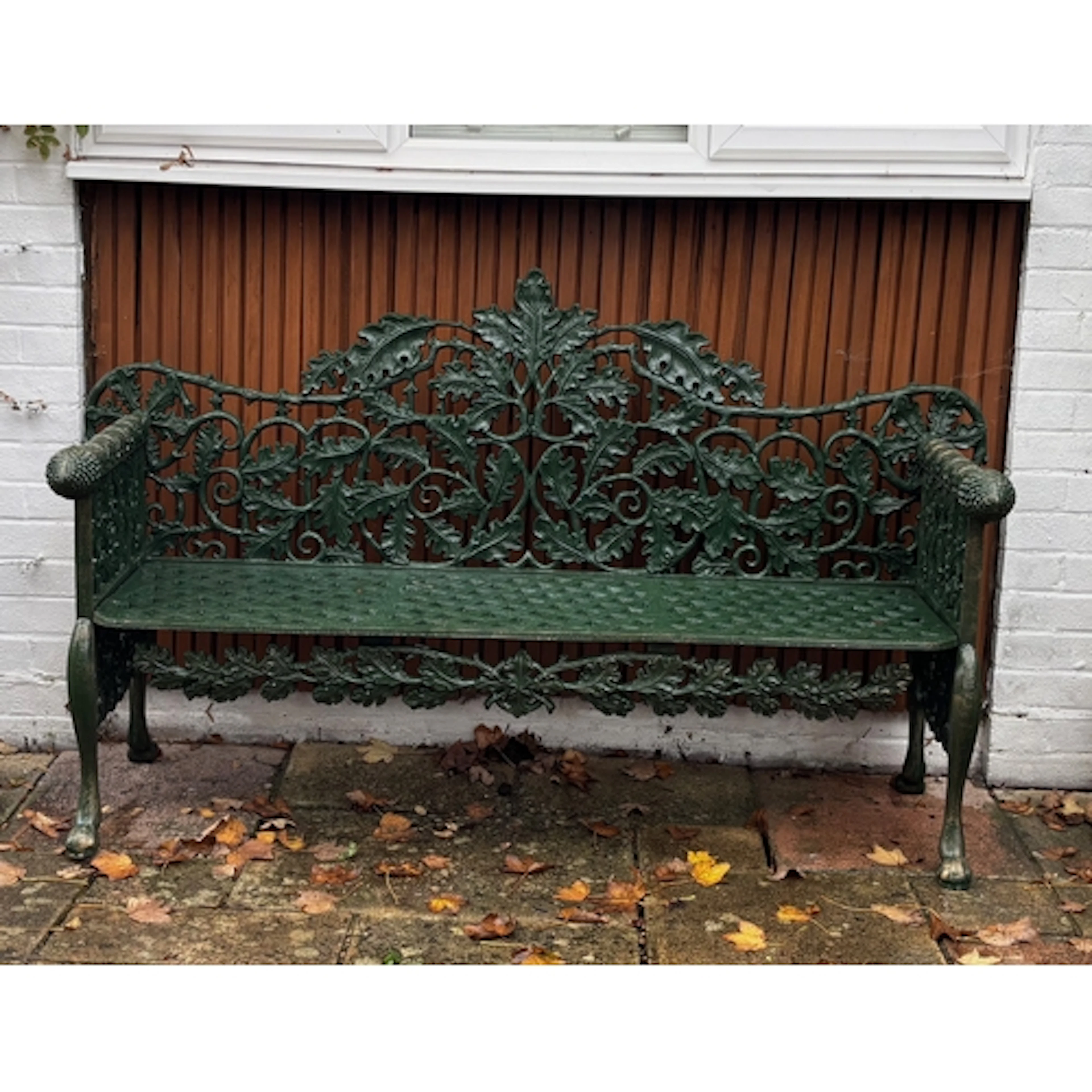 A spectacular and very finely cast classical garden bench in...