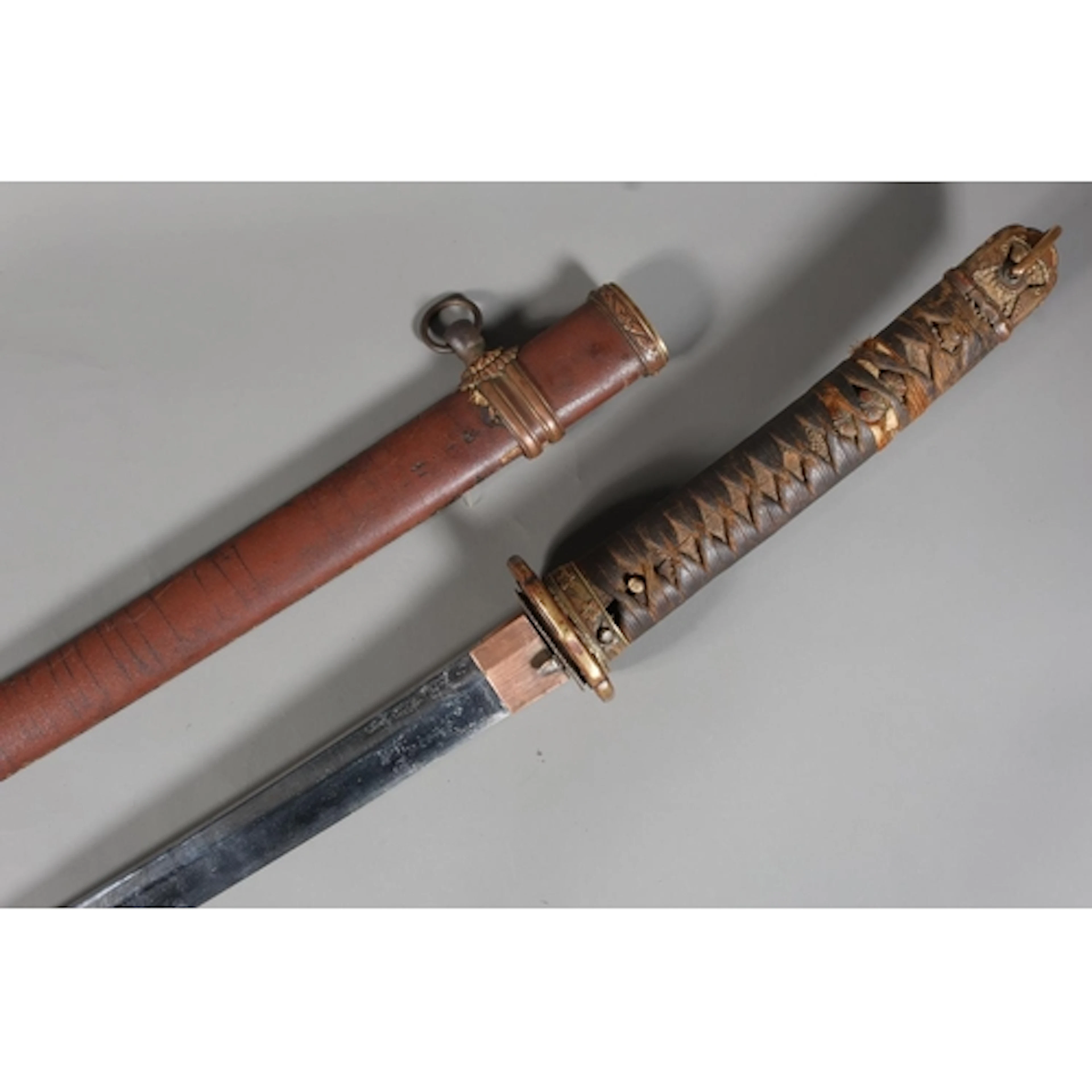 Japanese katana sword of typical form with gilded bronze tsu...