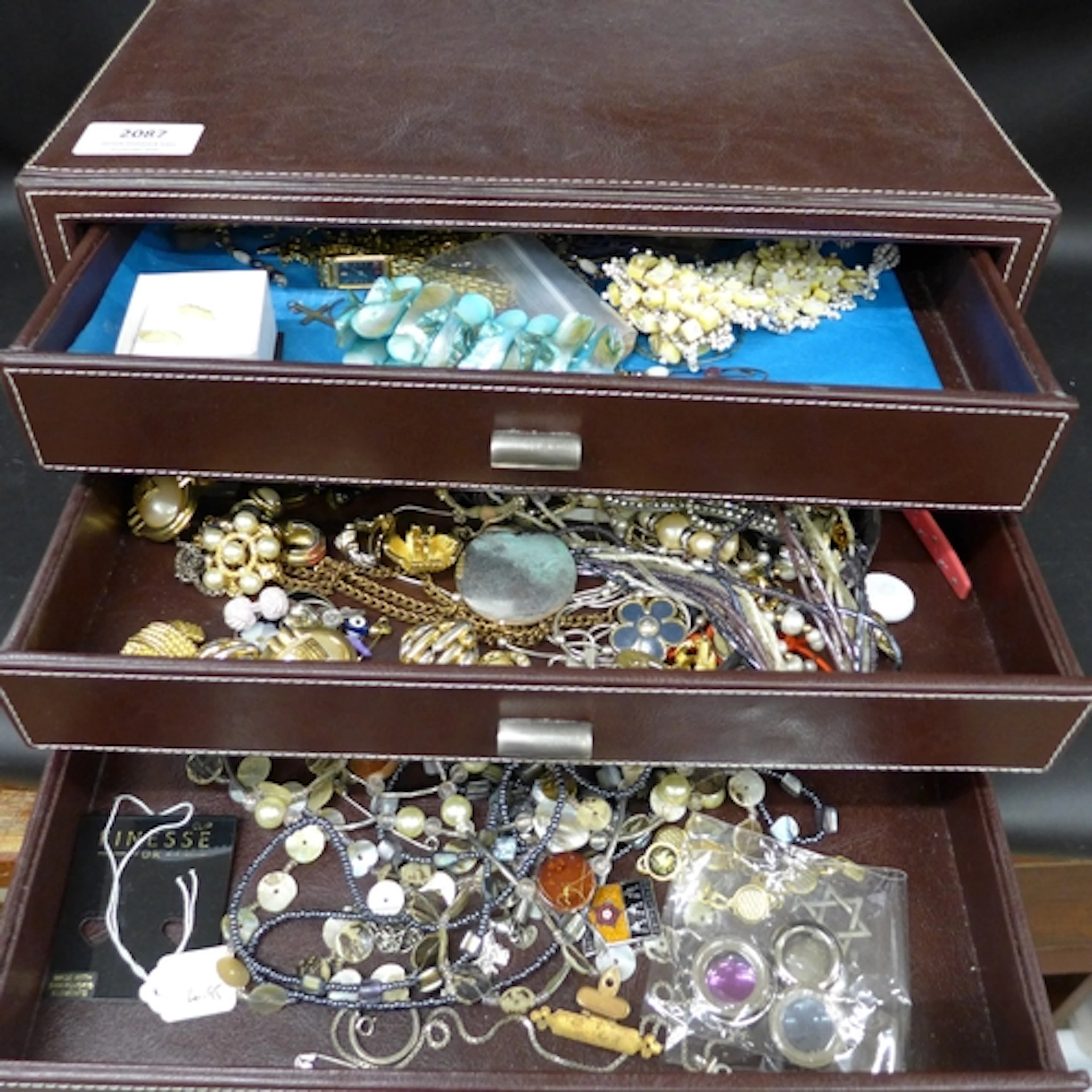 A jewellery box containing costume jewellery, including pair...