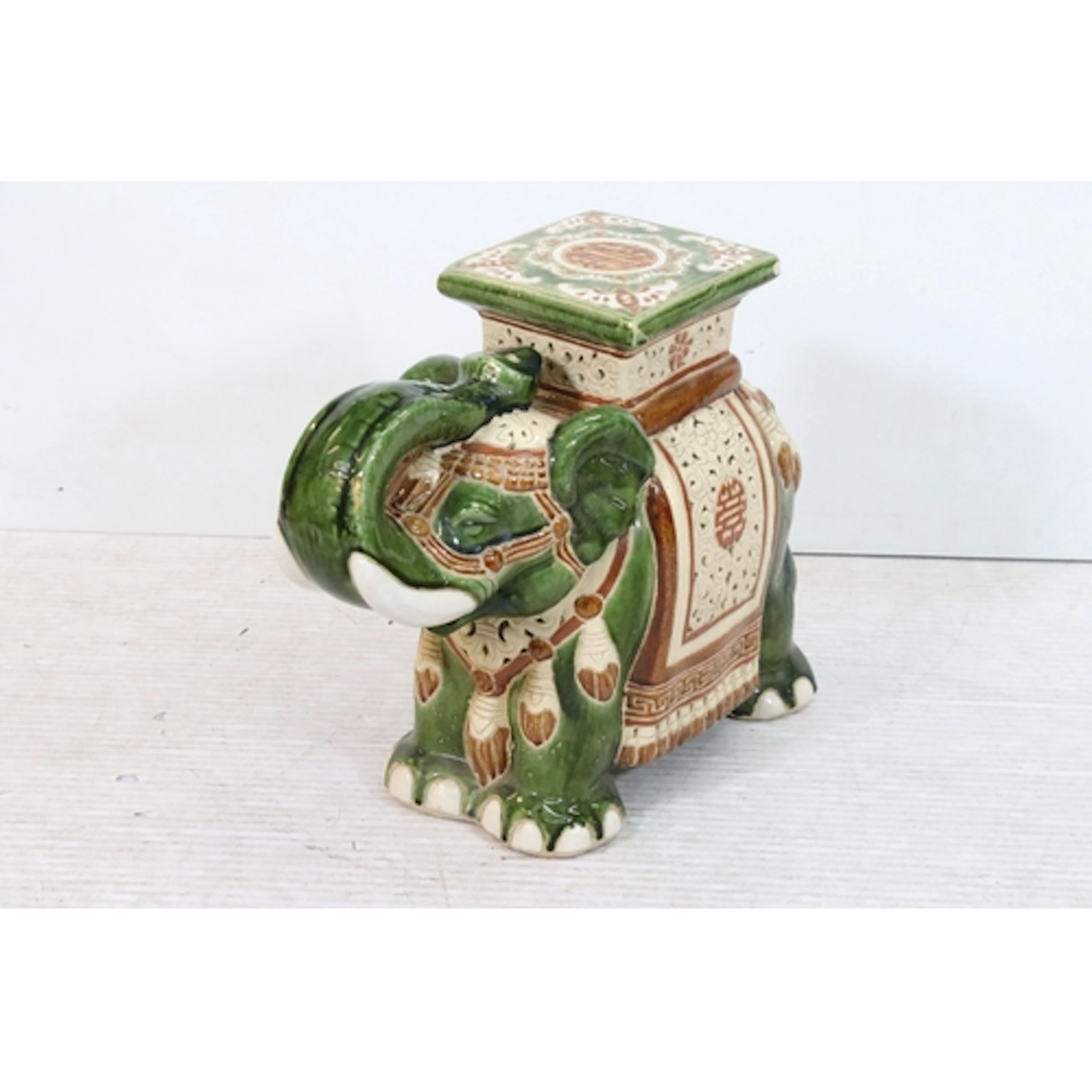 20th century ceramic elephant garden seat, having zhou chara...