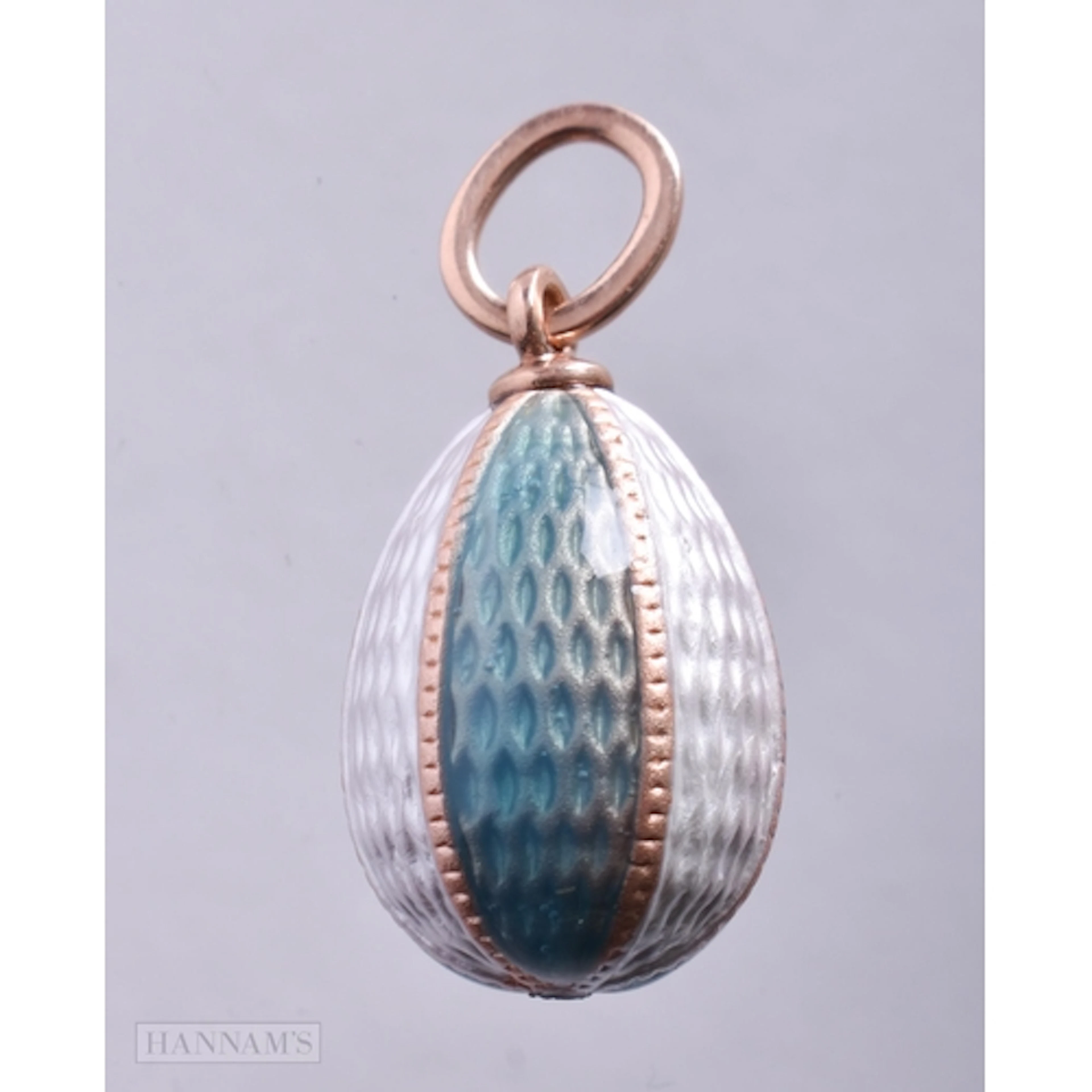 A Green and White Enamel Egg Pendant with a 14 Carat Gold Ba...