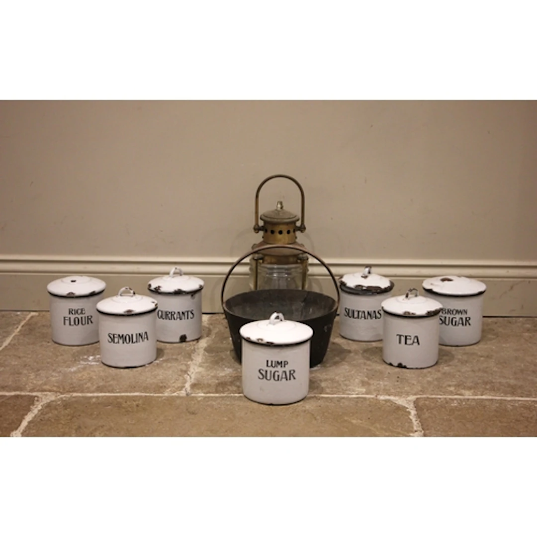 Seven white enamel kitchen storage containers, early/mid 20t...
