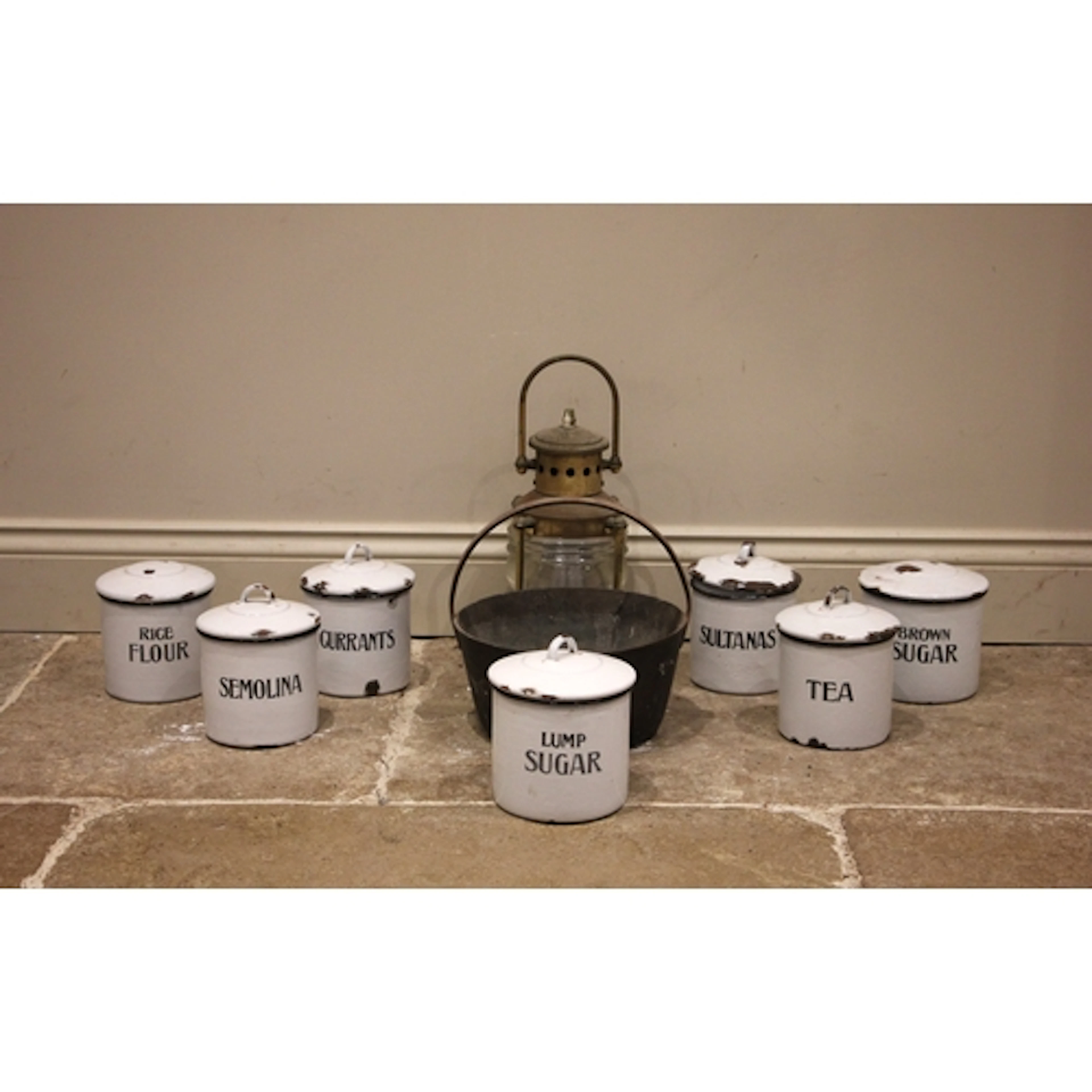 Seven white enamel kitchen storage containers, early/mid 20t...
