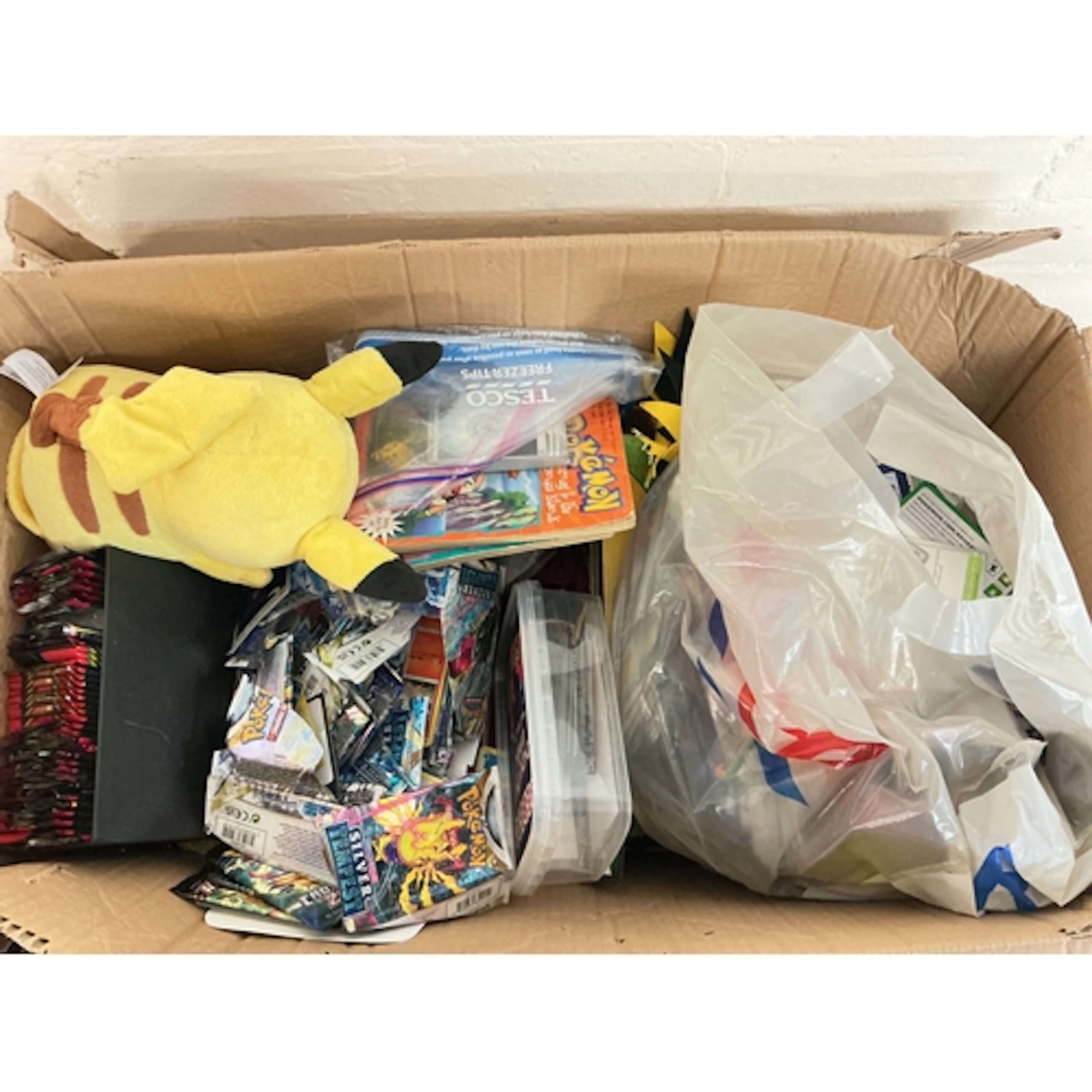 A Collection Of Modern Pokemon Cards And Toys.