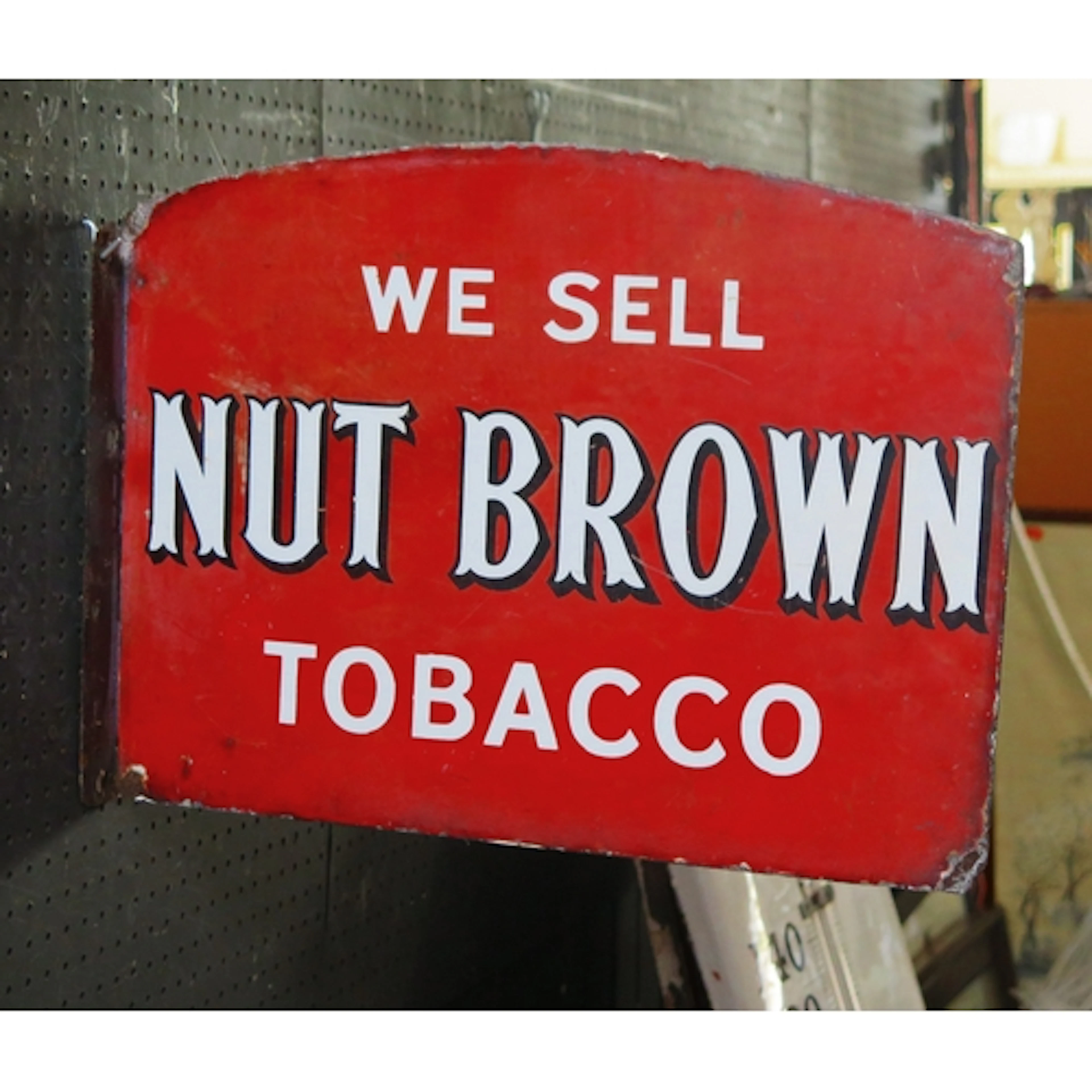 "We Sell Nut Brown Tobacco" - an enamel double-sided adverti...