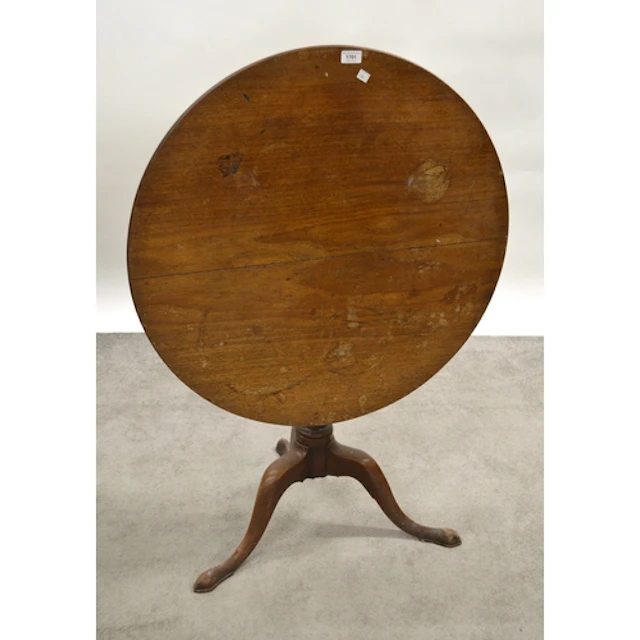 George III circular mahogany tilt top pedestal table, on tri...