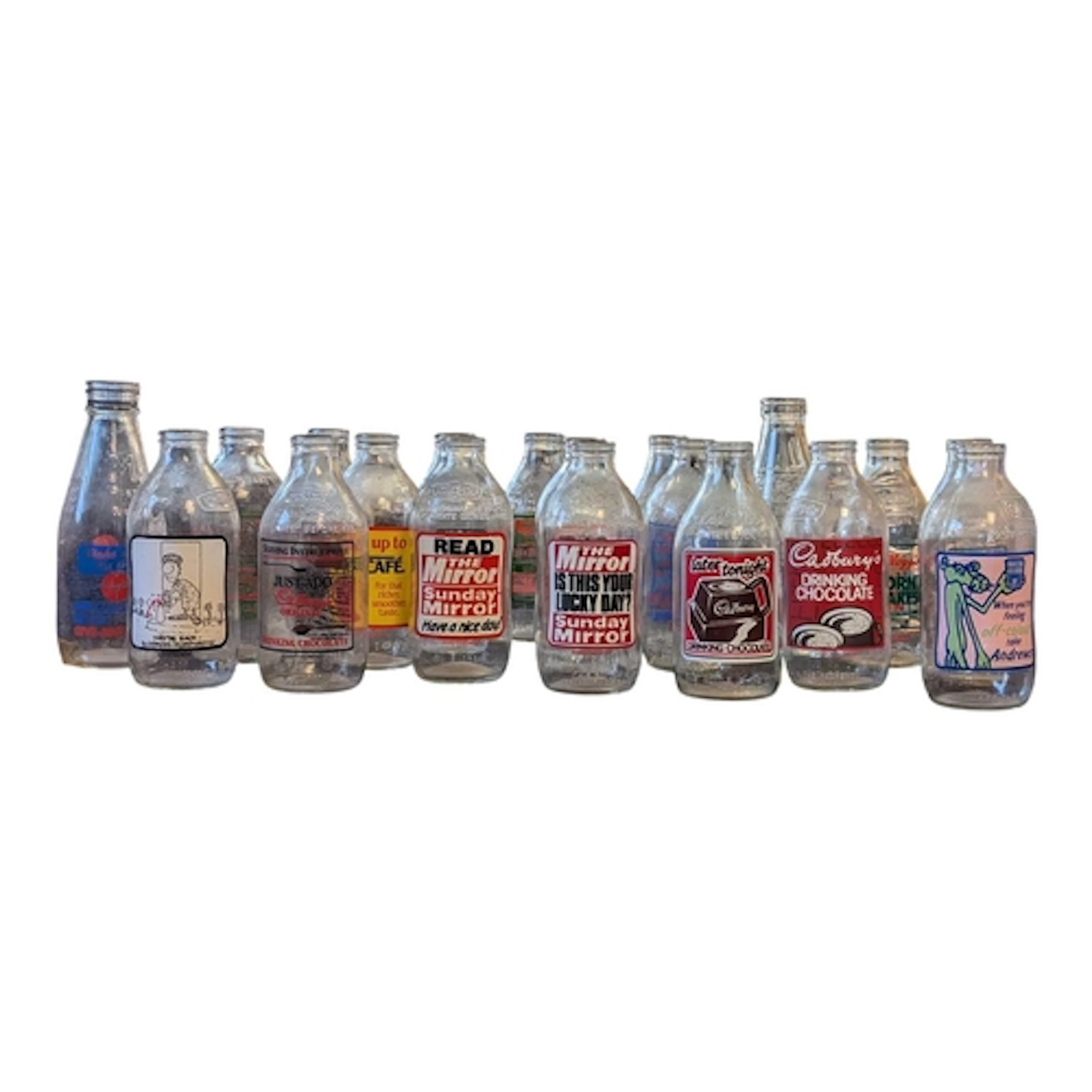 A colection of vintage 20th century glass milk bottles. The ...