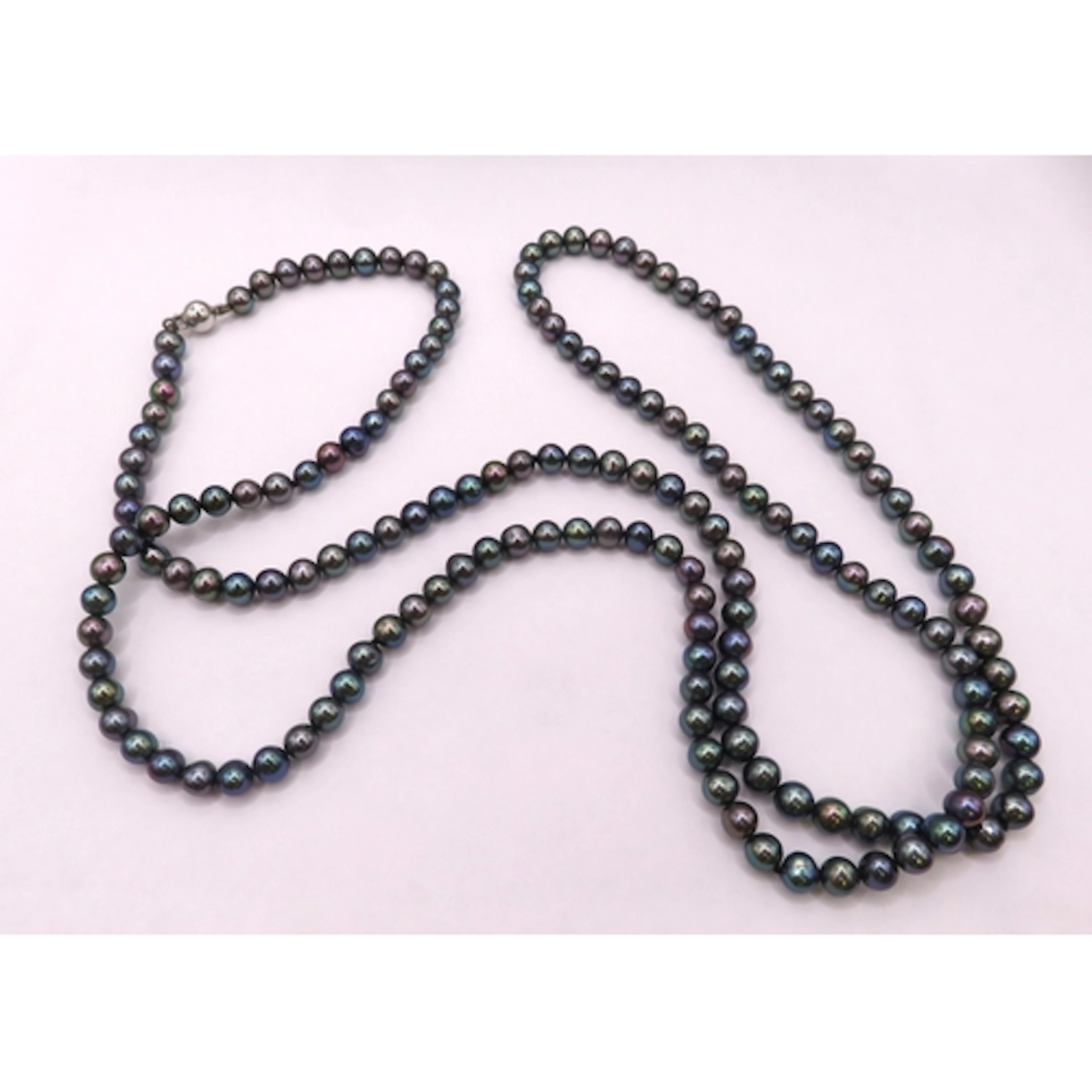 Single row black cultured pearl necklace with a 14ct white g...