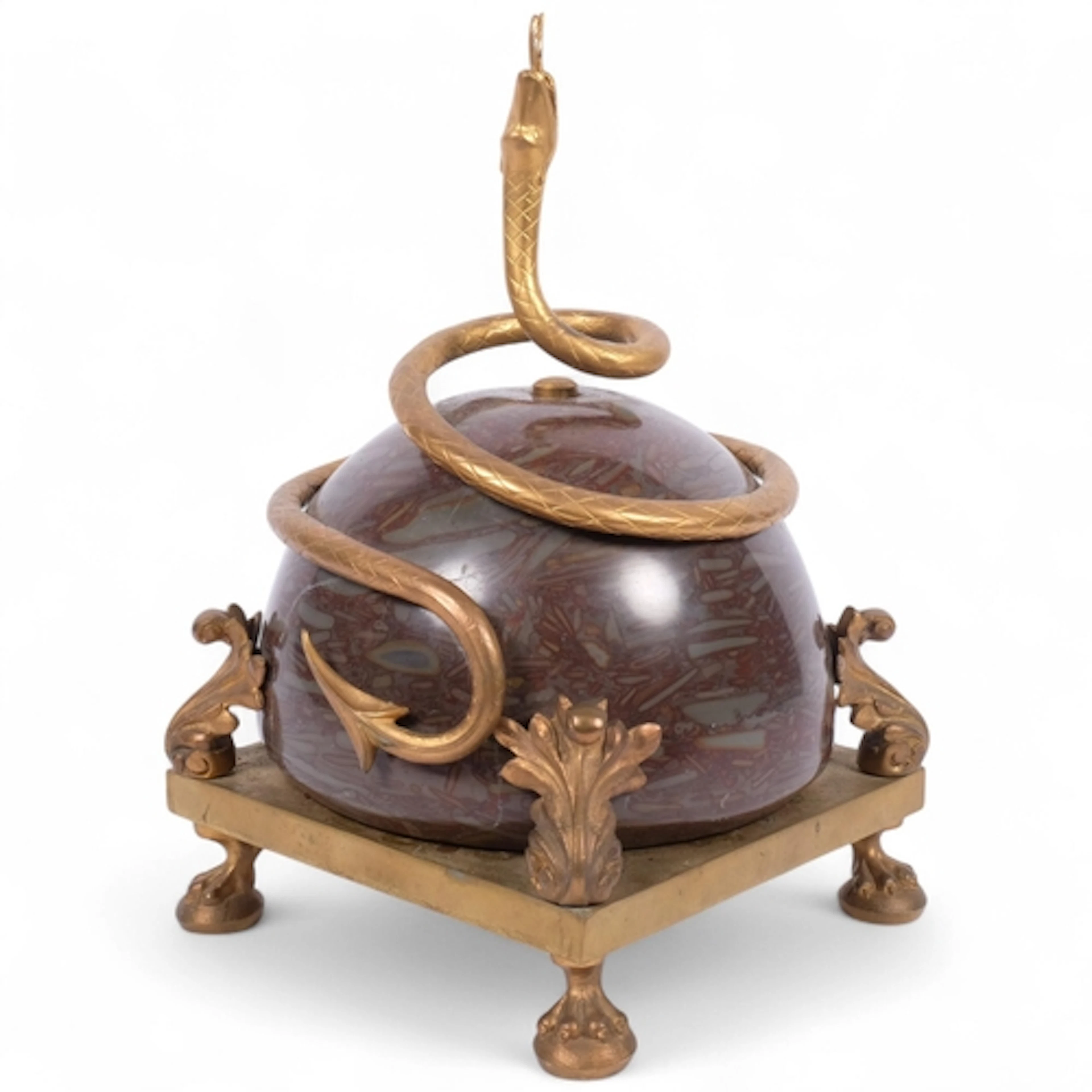 An ornate table centre piece, depicting a gilt-brass serpent...
