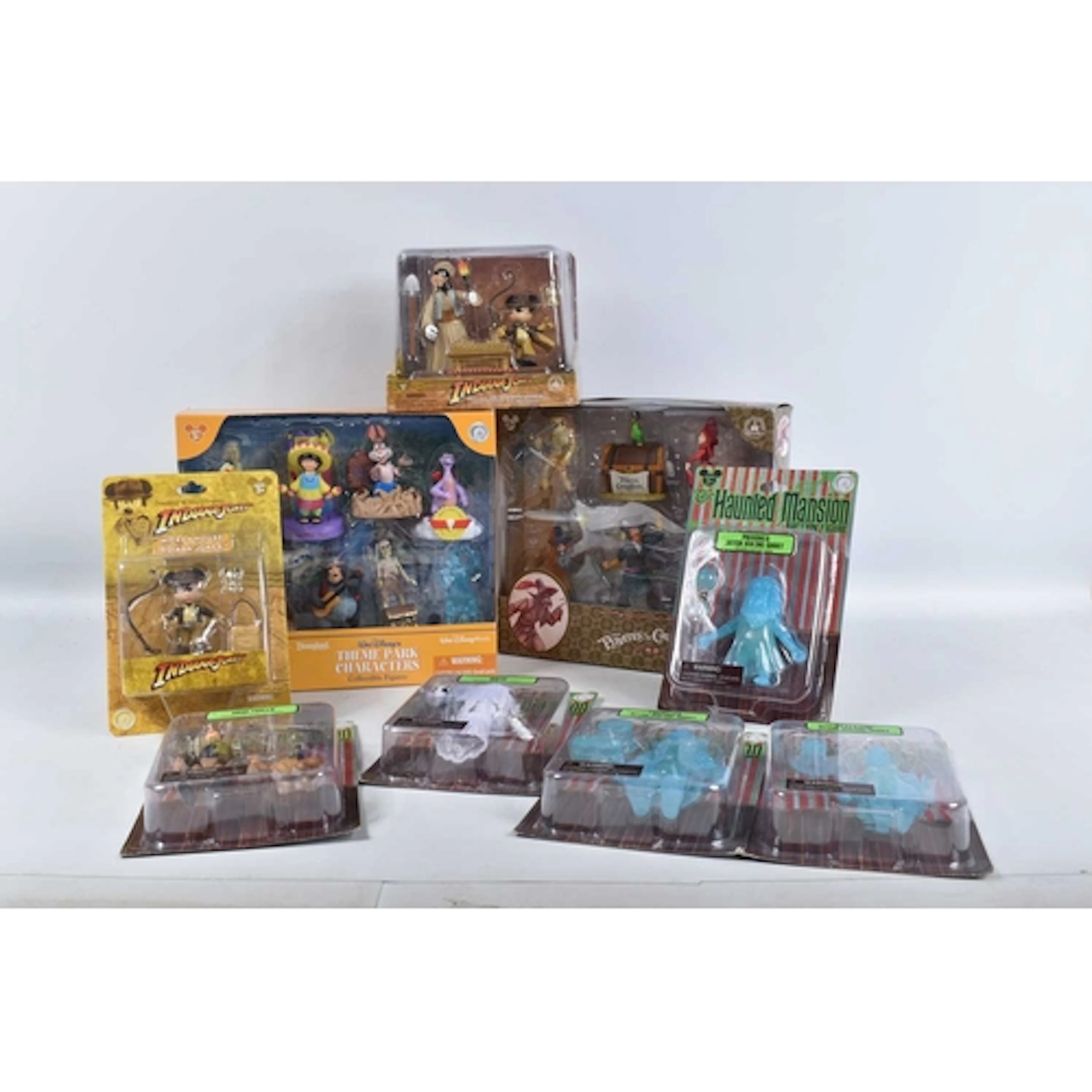 A COLLECTION OF BOXED DISNEY PARKS COLLECTIBLE FIGURES AND S...