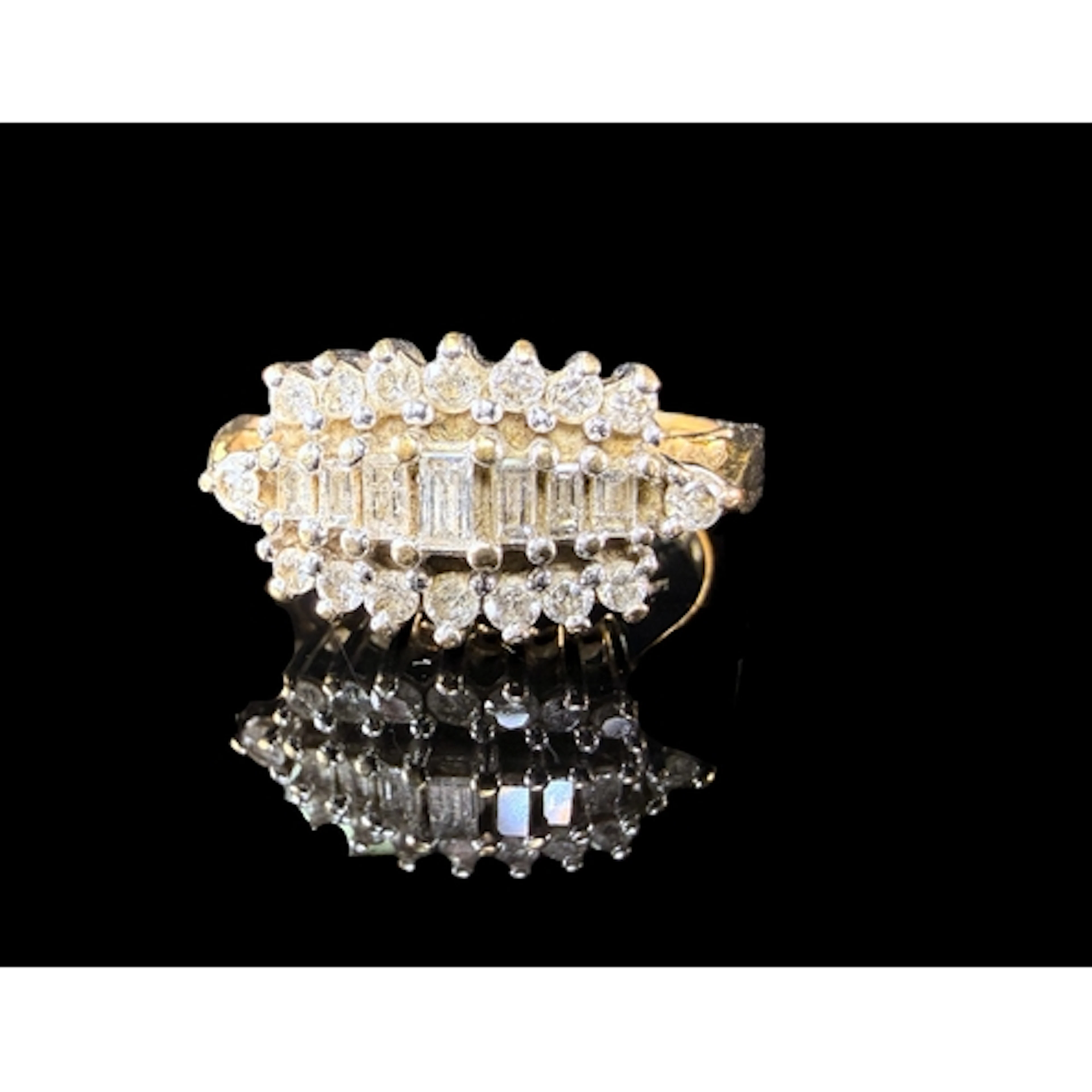 A 9 carat hallmarked gold baguette and cushion cut diamond r...