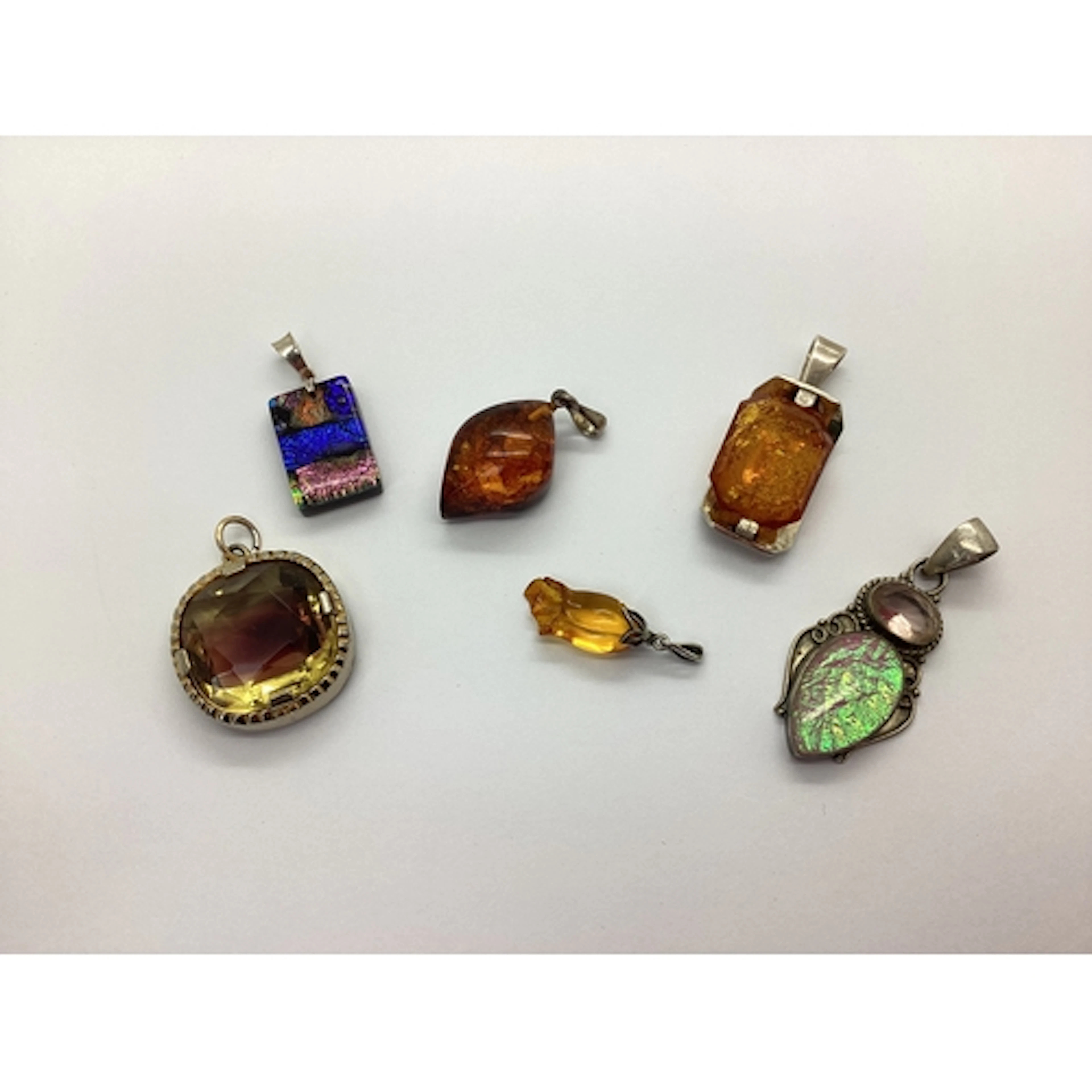 A Modernist Style Amber Coloured Pendant, the rectangular fa...