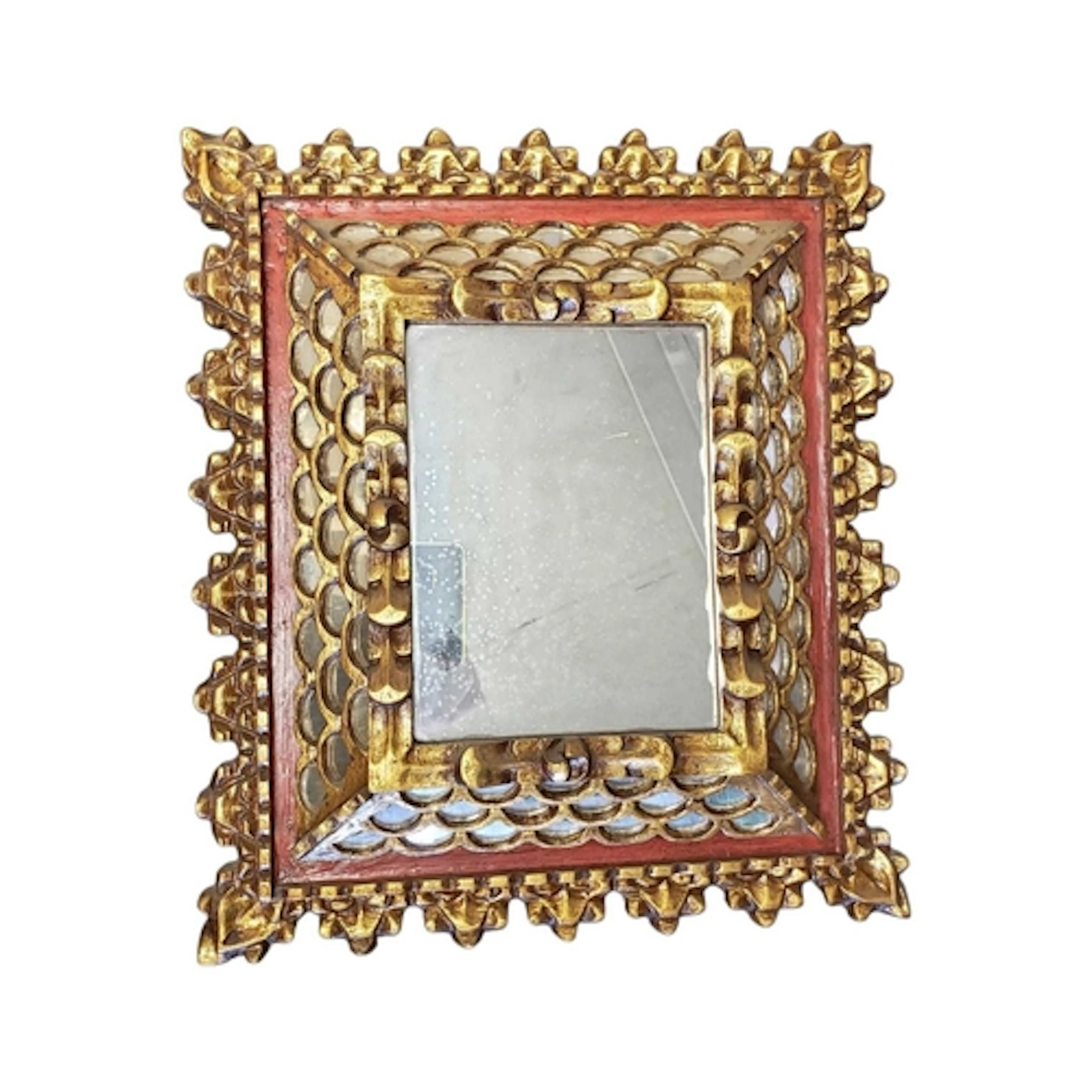 A 20th century Spanish Colonial style giltwood mirror. The m...
