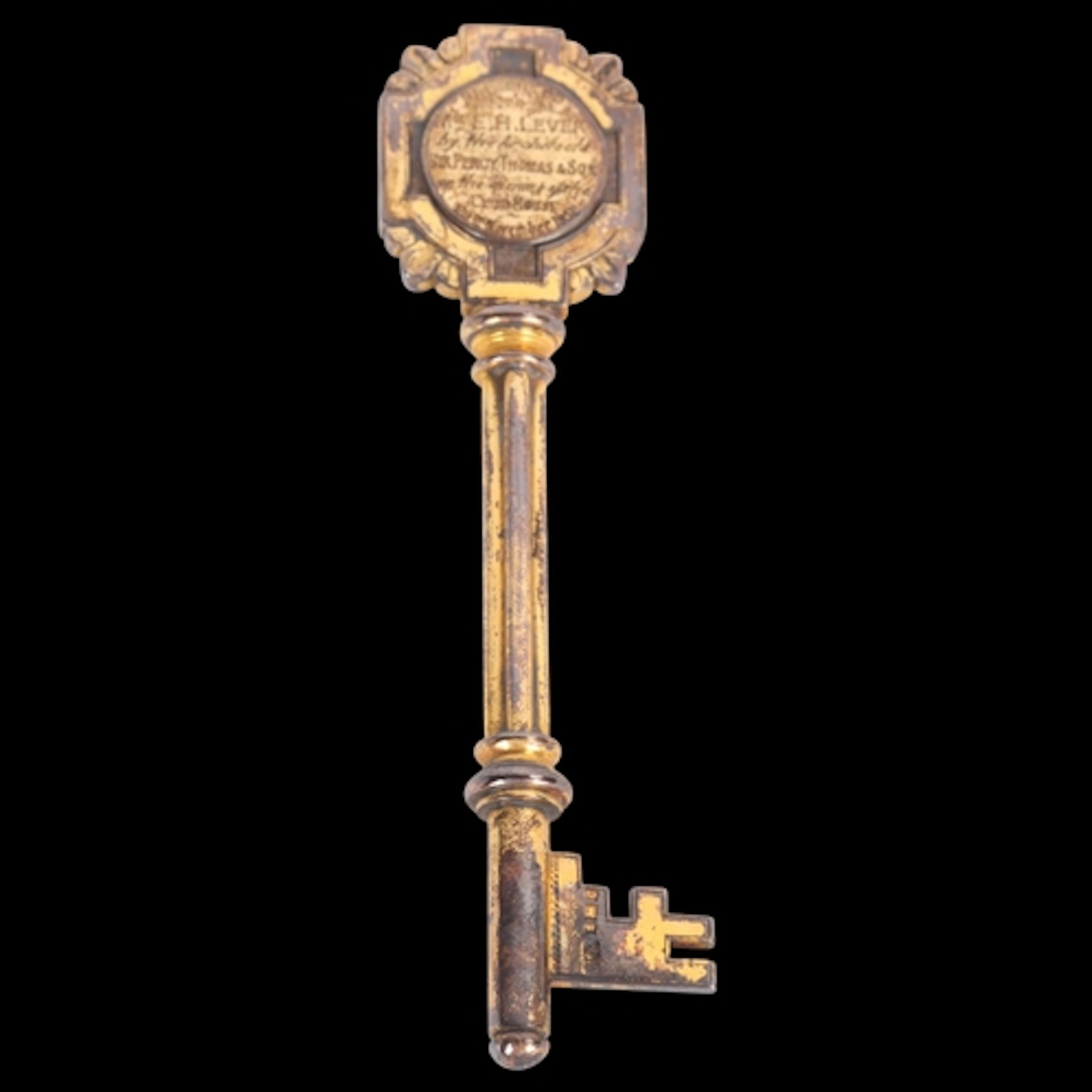 An Elizabeth II silver-gilt presentation key, James Fenton &...