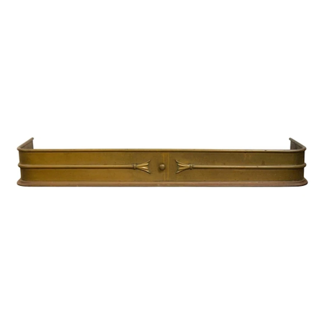 A late Victorian brass fender. With a central knob and centr...
