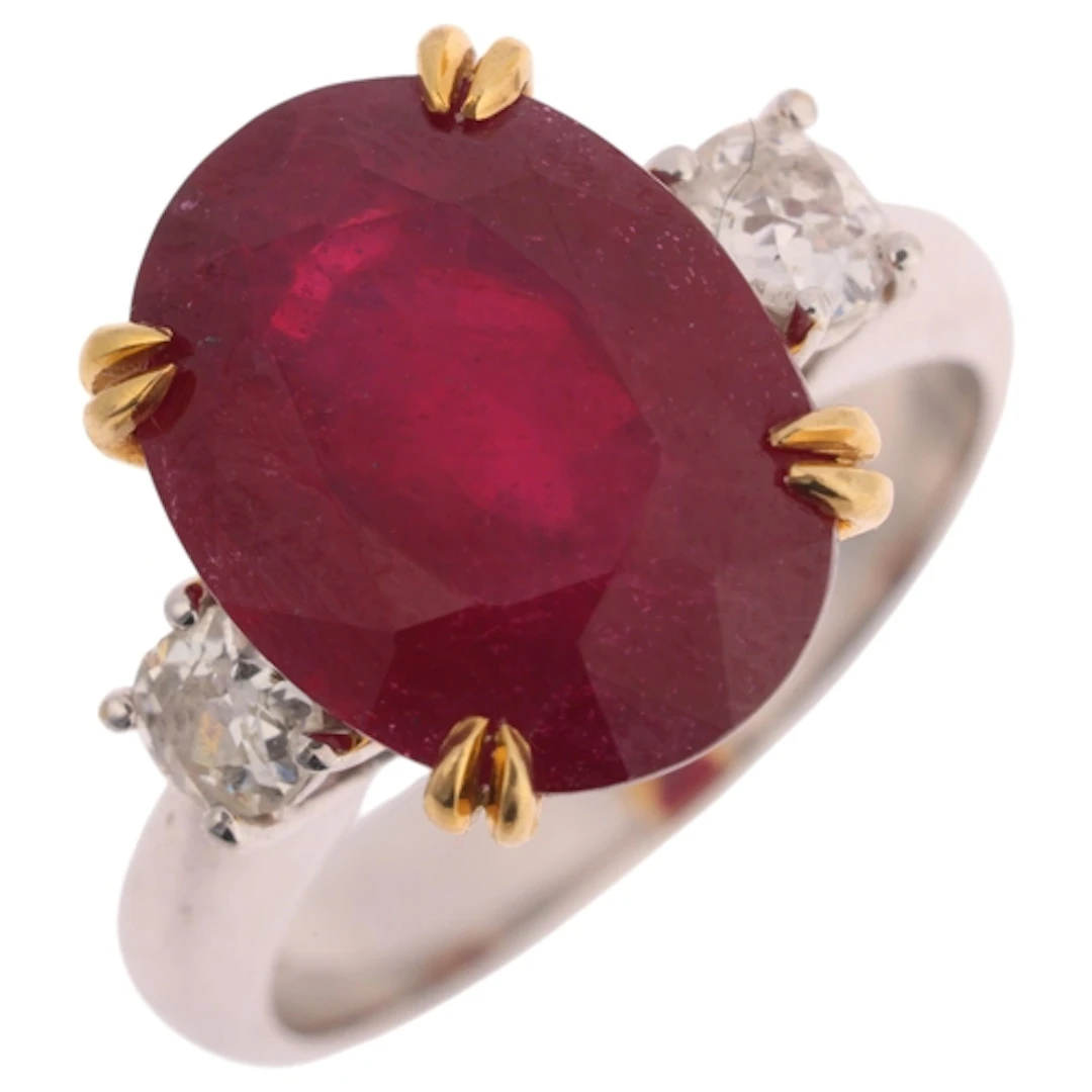 An 18ct two-colour gold three stone ruby and diamond ring, c...