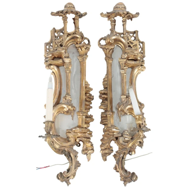 A pair of Chippendale style Pagoda topped mirror backed wall...