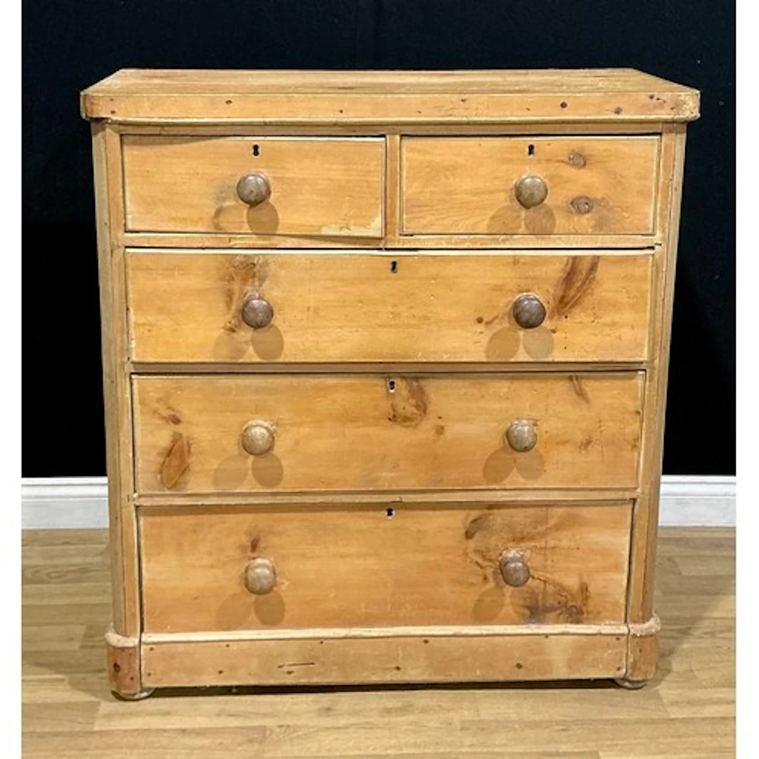 A Victorian pine chest, of two short and three long drawers,...