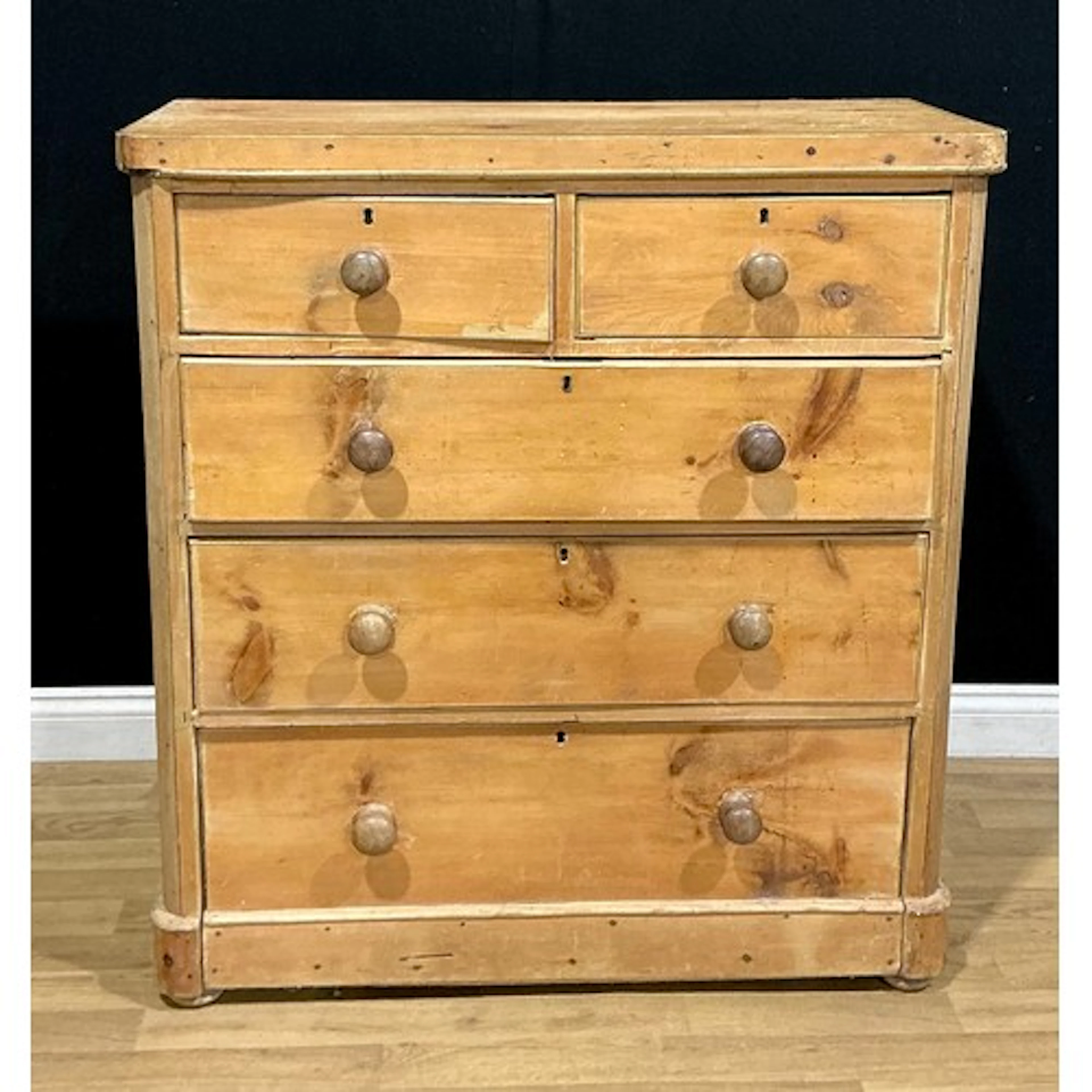 A Victorian pine chest, of two short and three long drawers,...