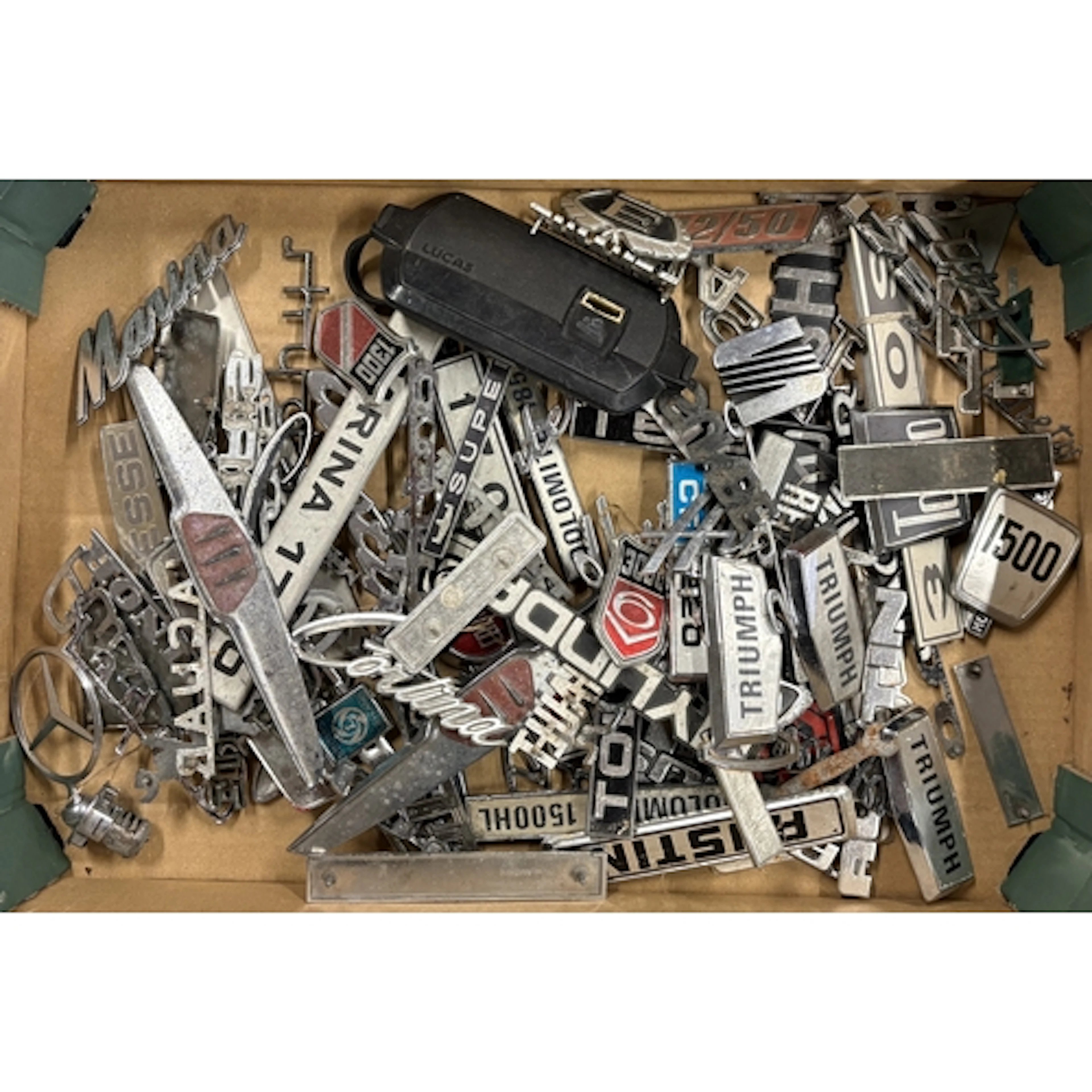 A collection of vintage motorcar badges. Est. £20 - £30.