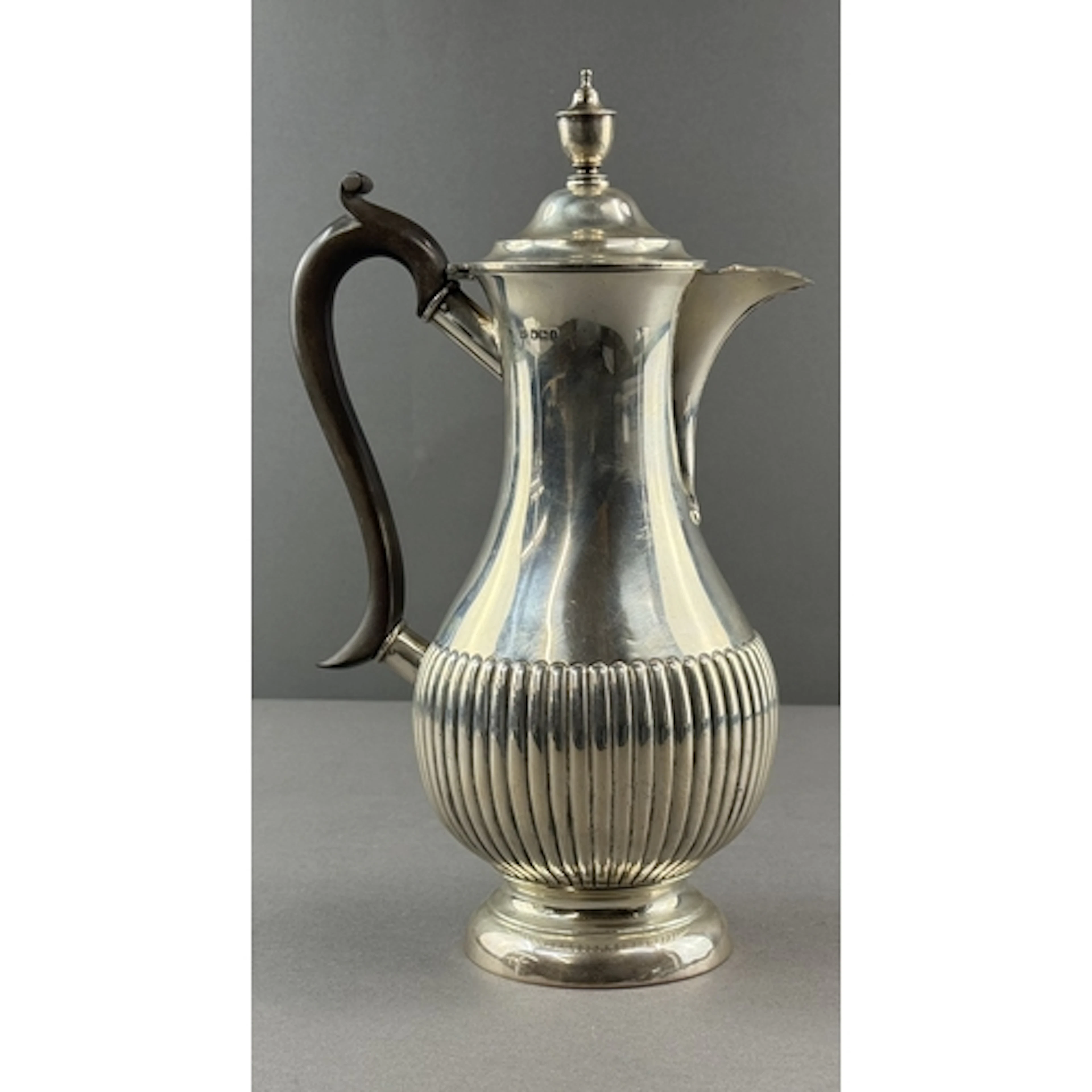 Silver: a hot water jug of baluster form by James Deakin &am...